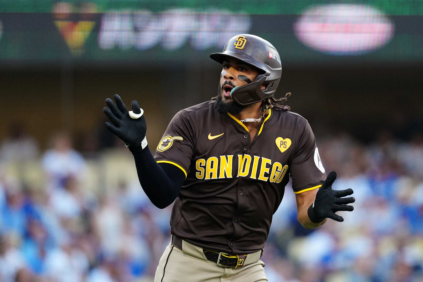 LOS ANGELES, CA - OCTOBER 06: Fernando Tatis Jr. #23 of the San Diego Padres celebrates after hitting a solo home run in the first inning during Game 2 of the Division Series presented by Booking.com between the San Diego Padres and the Los Angeles Dodgers at Dodger Stadium on Sunday, October 6, 2024 in Los Angeles, California. (Photo by Daniel Shirey/MLB Photos via Getty Images)