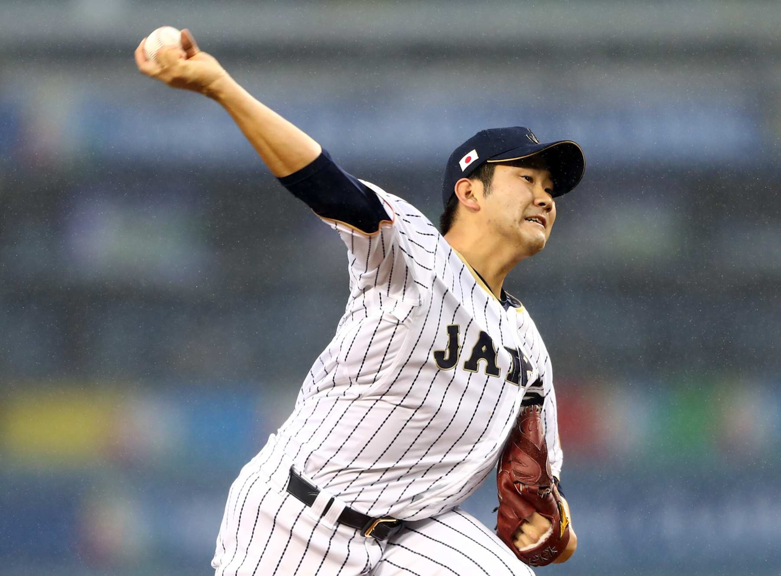 LOS ANGELES, CA - MARCH 21:  Tomoyuki Sugano #11 of Team Japan pitches during Game 2 of the Championship Round of the 2017 World Baseball Classic against Team USA on Tuesday, March 21, 2017 at Dodger Stadium in Los Angeles, California. (Photo by Alex Trautwig/WBCI/MLB via Getty Images) 