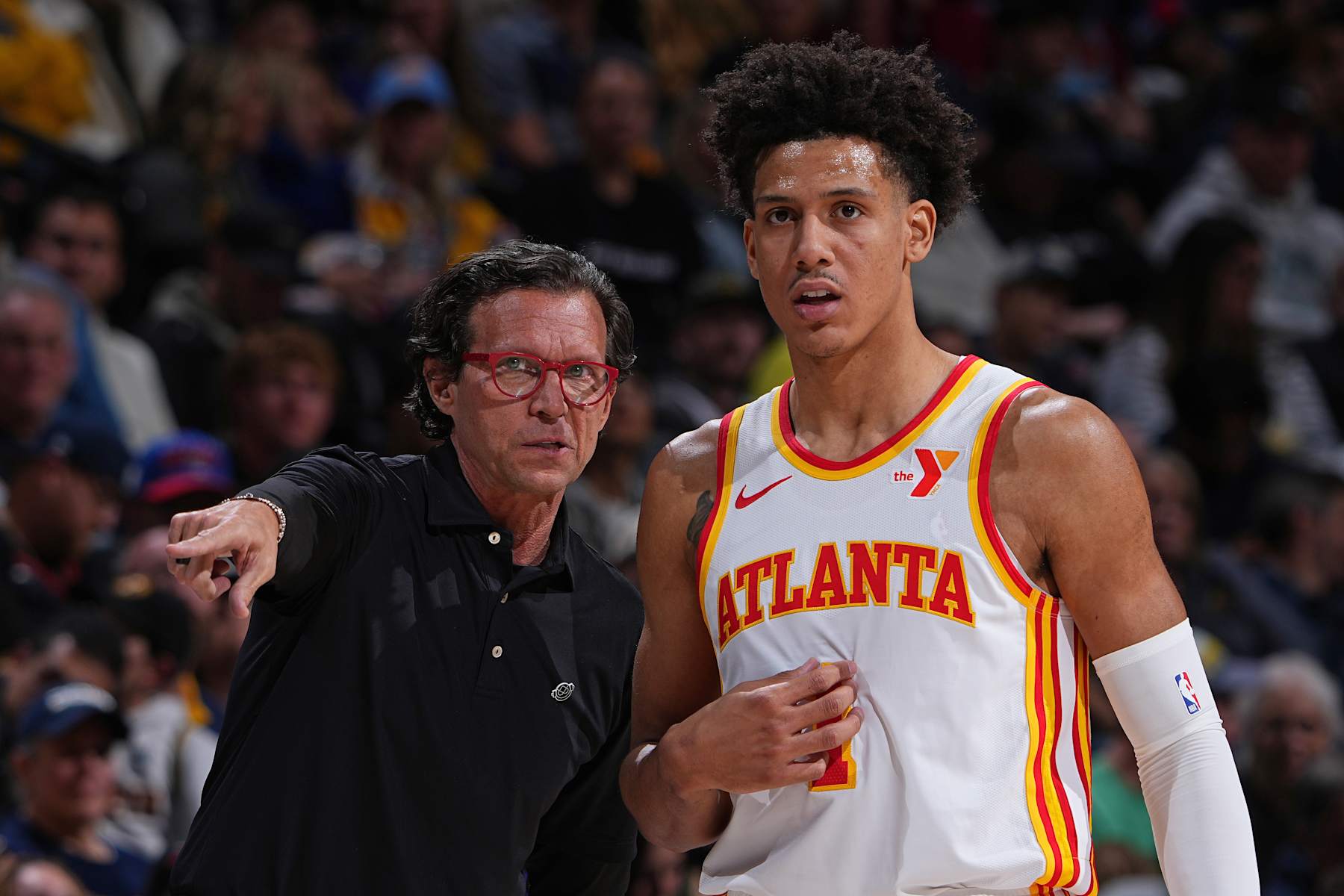 DENVER, CO - APRIL 6: Head Coach Quin Snyder of the Atlanta Hawks and Jalen Johnson #1 look on during the game against the Denver Nuggets on April 6, 2024 at the Ball Arena in Denver, Colorado. NOTE TO USER: User expressly acknowledges and agrees that, by downloading and/or using this Photograph, user is consenting to the terms and conditions of the Getty Images License Agreement. Mandatory Copyright Notice: Copyright 2024 NBAE (Photo by Garrett Ellwood/NBAE via Getty Images)