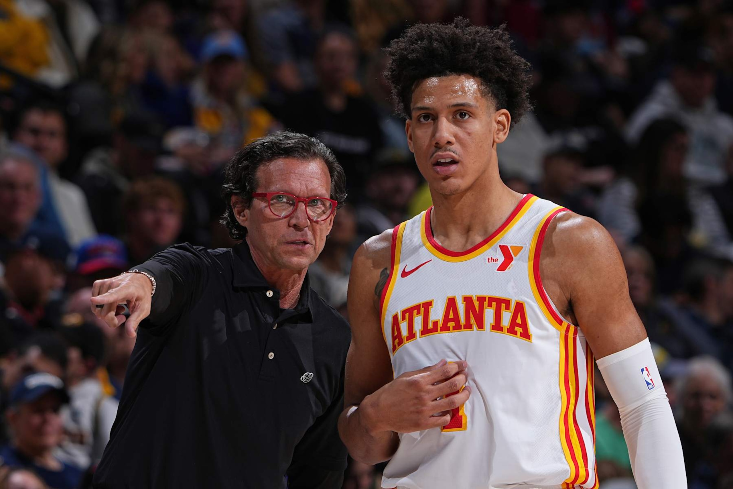 DENVER, CO - APRIL 6: Head Coach Quin Snyder of the Atlanta Hawks and Jalen Johnson #1 look on during the game against the Denver Nuggets on April 6, 2024 at the Ball Arena in Denver, Colorado. NOTE TO USER: User expressly acknowledges and agrees that, by downloading and/or using this Photograph, user is consenting to the terms and conditions of the Getty Images License Agreement. Mandatory Copyright Notice: Copyright 2024 NBAE (Photo by Garrett Ellwood/NBAE via Getty Images)