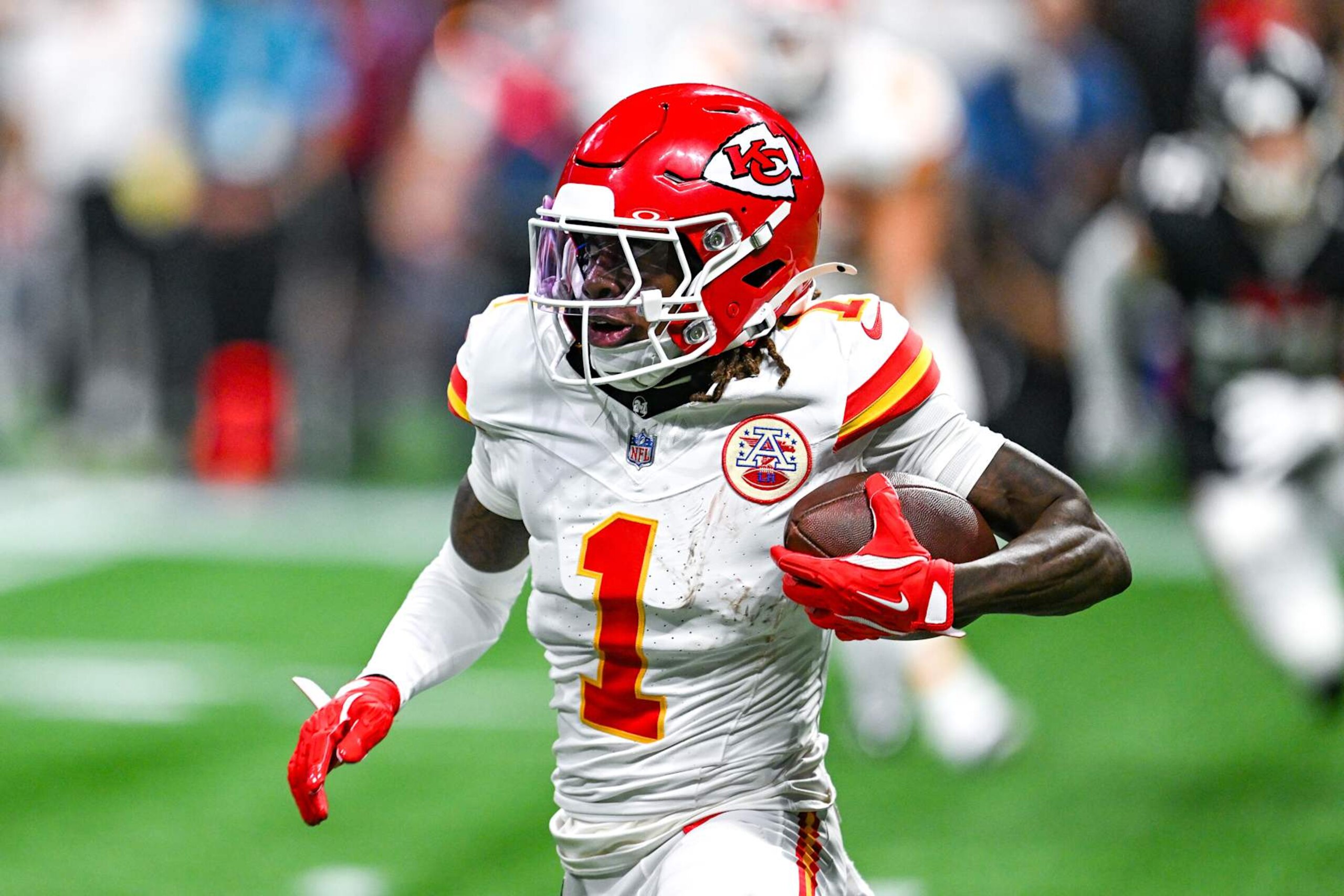 ATLANTA, GA  SEPTEMBER 22:  Kansas City wide receiver Xavier Worthy (1) runs with the ball following a reception during the NFL game between the Kansas City Chiefs and the Atlanta Falcons on September 22nd, 2024 at Mercedes-Benz Stadium in Atlanta, GA.  (Photo by Rich von Biberstein/Icon Sportswire via Getty Images)