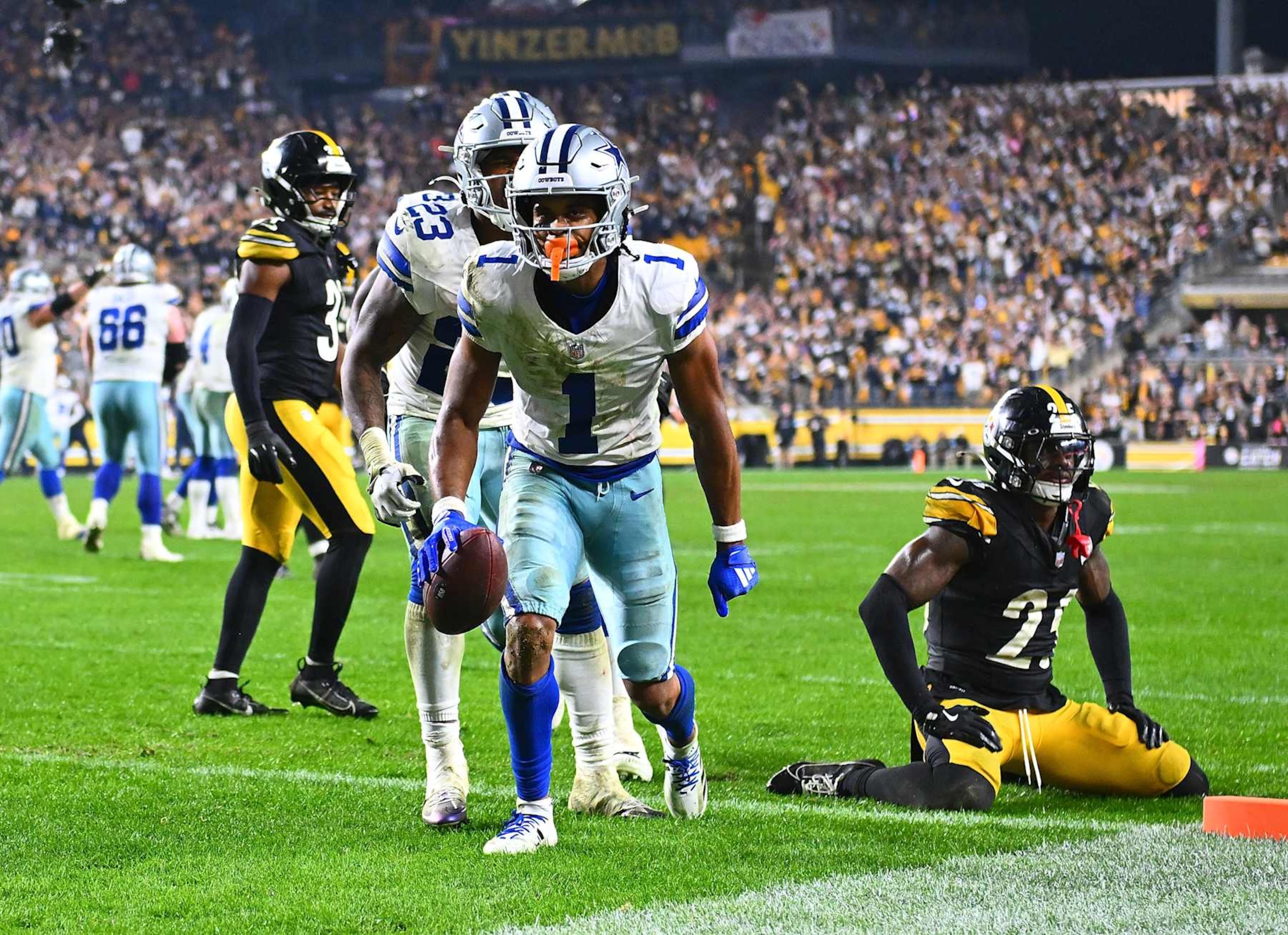 PITTSBURGH, PENNSYLVANIA - OCTOBER 7:  Jalen Tolbert #1 of the Dallas Cowboys celebrates his touchdown  in front of DeShon Elliott #25 of the Pittsburgh Steelers during the fourth quarter at Acrisure Stadium on October 7, 2024 in Pittsburgh, Pennsylvania. Dallas won the game 20-17. (Photo by Joe Sargent/Getty Images)
