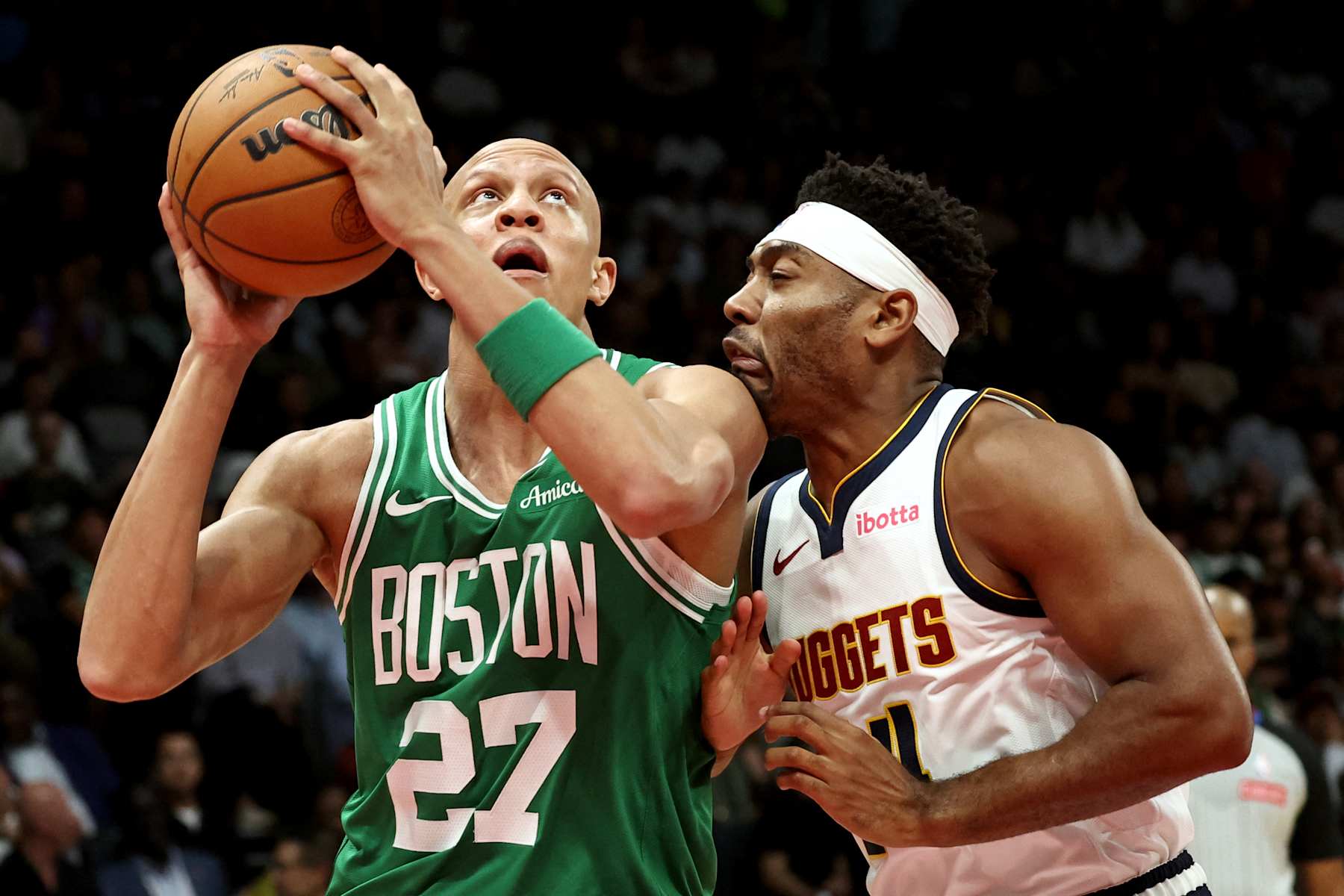 Boston Celtics' forward #27 Jordan Walsh fights for the ball with Denver Nuggets' guard #27 Jamal Murray during the NBA Preseason game between the Boston Celtics and the Denver Nuggets at the Etihad Arena in Abu Dhabi on October 6, 2024. (Photo by Fadel Senna / AFP) (Photo by FADEL SENNA/AFP via Getty Images)
