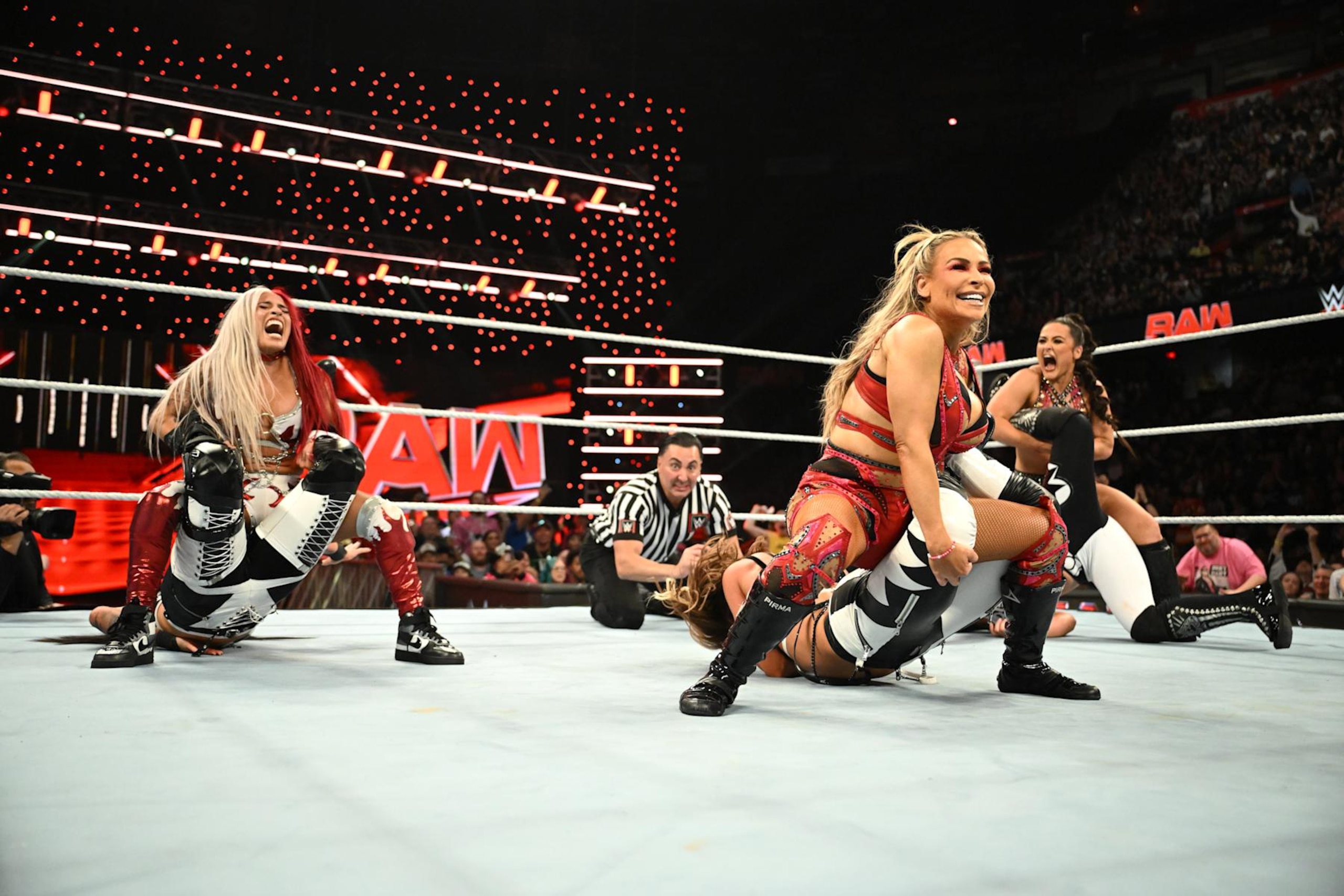 CALGARY, CANADA - SEPTEMBER 09: (L-R) Zelina Vega, Natalya and Lyra Valkyria but submission holds against members of The Pure Fusion Collective during Monday Night RAW at the Scotiabank Saddledome on September 9, 2024 in Calgary, Canada. (Photo by WWE/Getty Images) CALGARY, CANADA - SEPTEMBER 09: (L-R) Zelina Vega, Natalya and Lyra Valkyria but submission holds against members of The Pure Fusion Collective during Monday Night RAW at the Scotiabank Saddledome on September 9, 2024 in Calgary, Canada. (Photo by WWE/Getty Images)