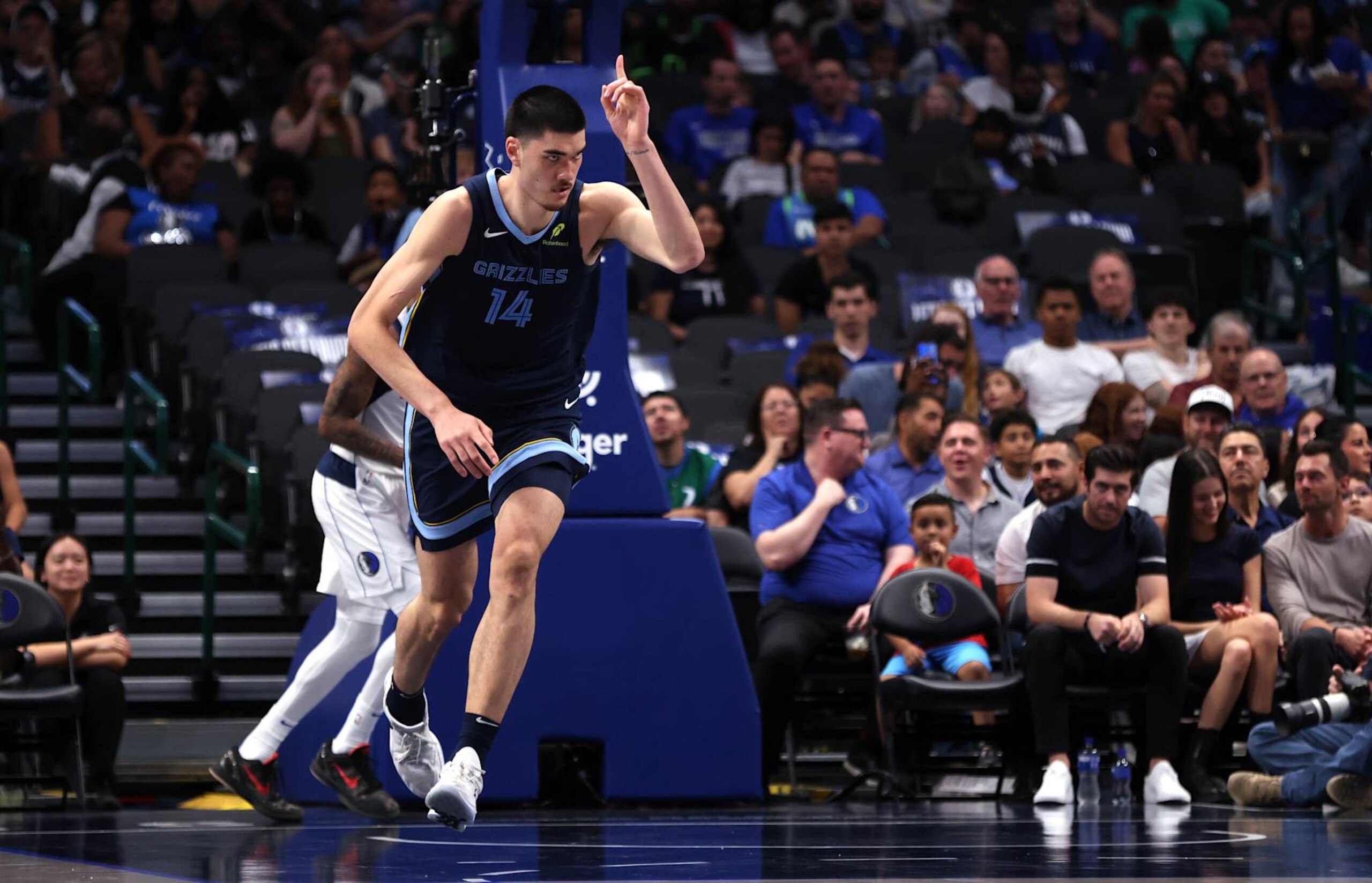 DALLAS, TX - OCTOBER 7: Zach Edey #14 of the Memphis Grizzlies celebrates scoring a basket against the Dallas Mavericks in the first half of a preseason game at American Airlines Center on October 7, 2024 in Dallas, Texas. NOTE TO USER: User expressly acknowledges and agrees that, by downloading and or using this photograph, User is consenting to the terms and conditions of the Getty Images License Agreement. (Photo by Ron Jenkins/Getty Images) DALLAS, TX - OCTOBER 7: Zach Edey #14 of the Memphis Grizzlies celebrates scoring a basket against the Dallas Mavericks in the first half of a preseason game at American Airlines Center on October 7, 2024 in Dallas, Texas. NOTE TO USER: User expressly acknowledges and agrees that, by downloading and or using this photograph, User is consenting to the terms and conditions of the Getty Images License Agreement. (Photo by Ron Jenkins/Getty Images)