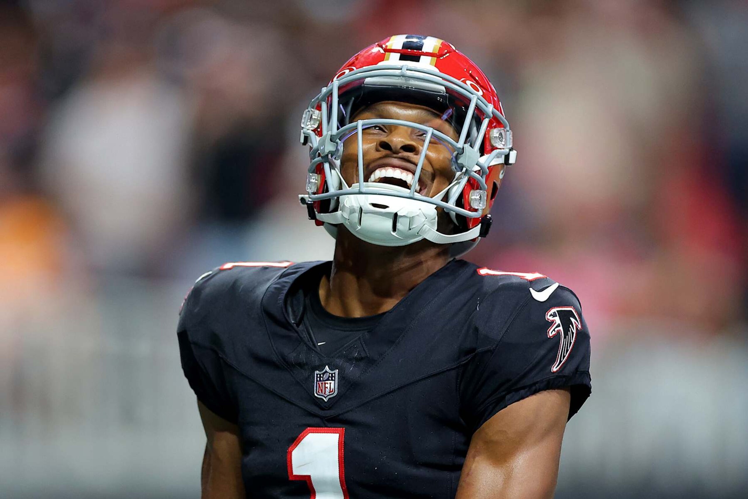 ATLANTA, GEORGIA - OCTOBER 03: Darnell Mooney #1 of the Atlanta Falcons celebrates after scoring a touchdown against the Tampa Bay Buccaneers during the second quarter at Mercedes-Benz Stadium on October 03, 2024 in Atlanta, Georgia. (Photo by Kevin C. Cox/Getty Images)