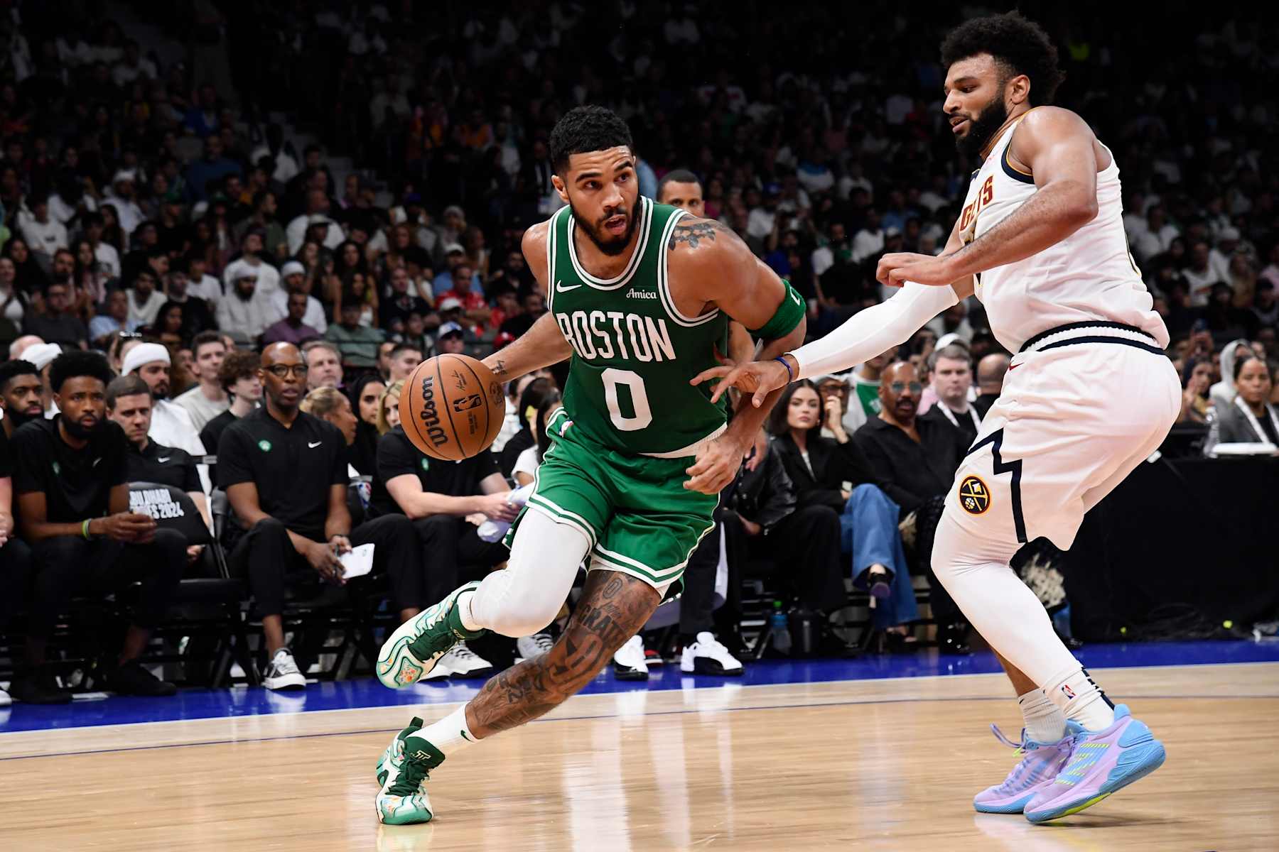 ABU DHABI, UAE - OCTOBER 6: Jayson Tatum #0 of the Boston Celtics dribbles the ball during the game against the Denver Nuggets during the 2024 Global Games on October 6, 2024 at the Etihad Arena in Abu Dhabi, United Arab Emirates. NOTE TO USER: User expressly acknowledges and agrees that, by downloading and/or using this Photograph, user is consenting to the terms and conditions of the Getty Images License Agreement. Mandatory Copyright Notice: Copyright 2024 NBAE (Photo by Brian Babineau/NBAE via Getty Images)