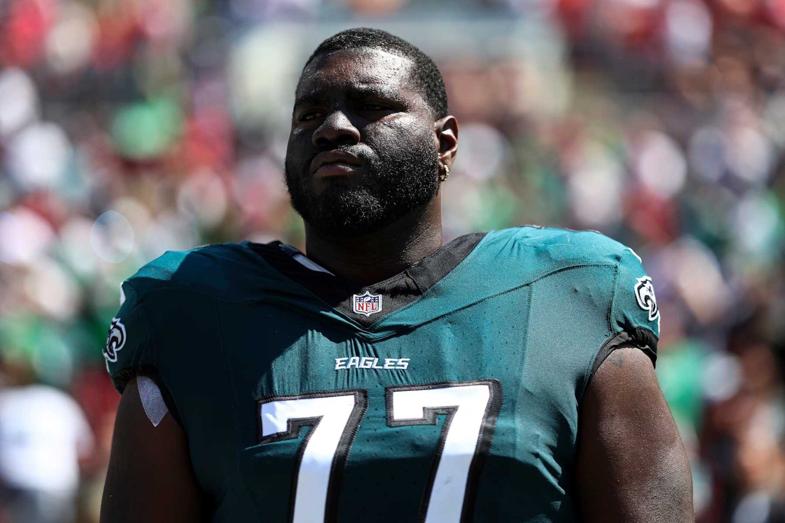 TAMPA, FL - SEPTEMBER 29: Mekhi Becton #77 of the Philadelphia Eagles stands on the sidelines during the national anthem prior to an NFL football game against the Tampa Bay Buccaneers at Raymond James Stadium on September 29, 2024 in Tampa, Florida. (Photo by Kevin Sabitus/Getty Images)
