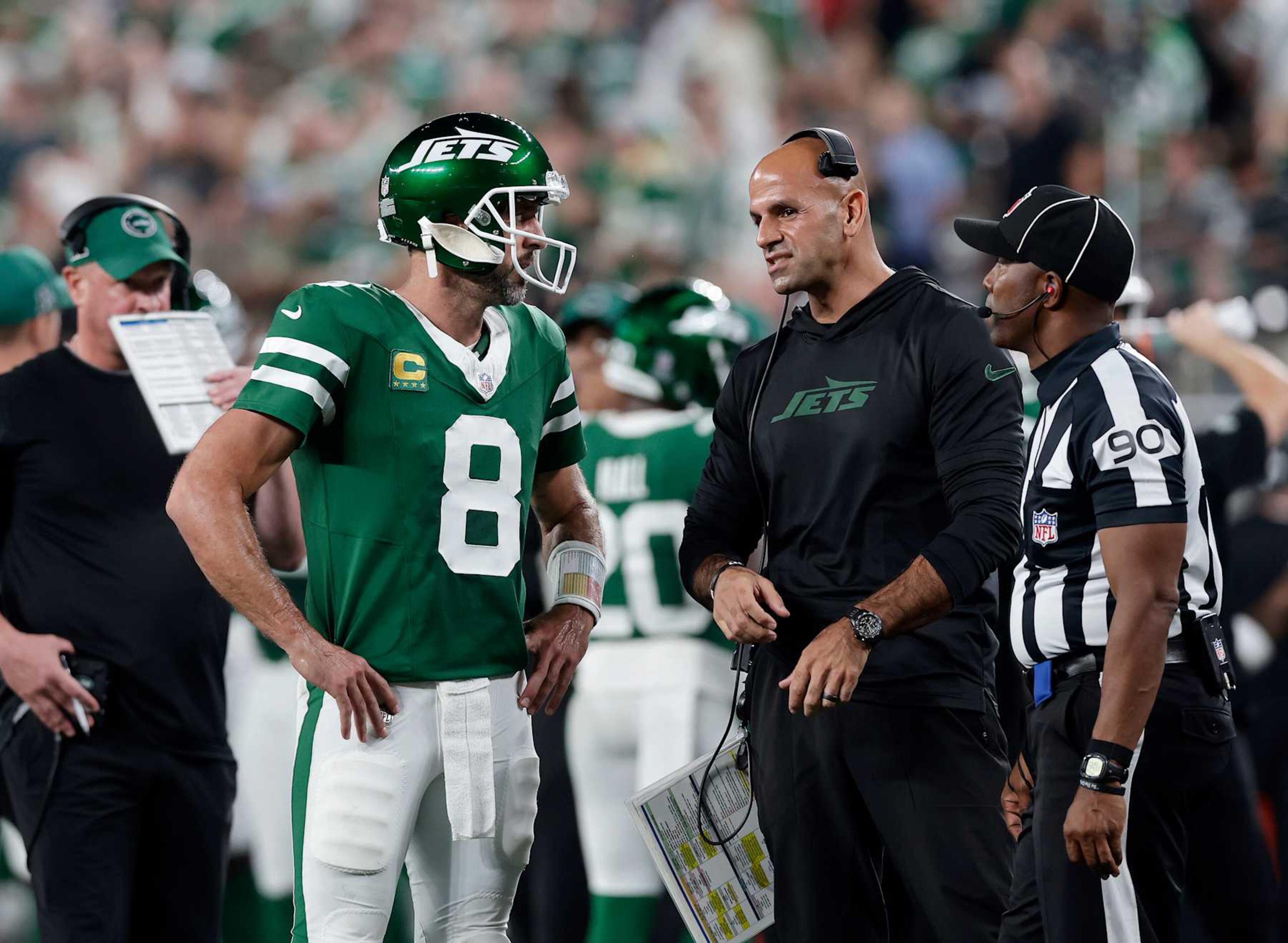 EAST RUTHERFORD, NEW JERSEY - SEPTEMBER 19: (NEW YORK DAILIES OUT) Aaron Rodgers #8 and head coach Robert Saleh of the New York Jets in action against the New England Patriots at MetLife Stadium on September 19, 2024 in East Rutherford, New Jersey. The Jets defeated the Patriots 24-3. (Photo by Jim McIsaac/Getty Images) EAST RUTHERFORD, NEW JERSEY - SEPTEMBER 19: (NEW YORK DAILIES OUT) Aaron Rodgers #8 and head coach Robert Saleh of the New York Jets in action against the New England Patriots at MetLife Stadium on September 19, 2024 in East Rutherford, New Jersey. The Jets defeated the Patriots 24-3. (Photo by Jim McIsaac/Getty Images)