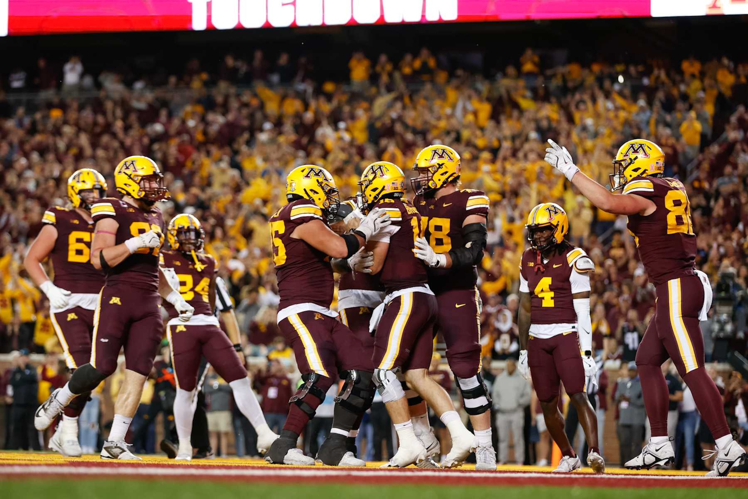 MINNEAPOLIS, MN - OCTOBER 05: Minnesota Golden Gophers quarterback Max Brosmer (16) celebrates with teammates after scoring a touchdown during the college football game between the USC Trojans and the Minnesota Golden Gophers on October 5th, 2024, at Huntington Bank Stadium in Minneapolis, MN. (Photo by Bailey Hillesheim/Icon Sportswire via Getty Images)