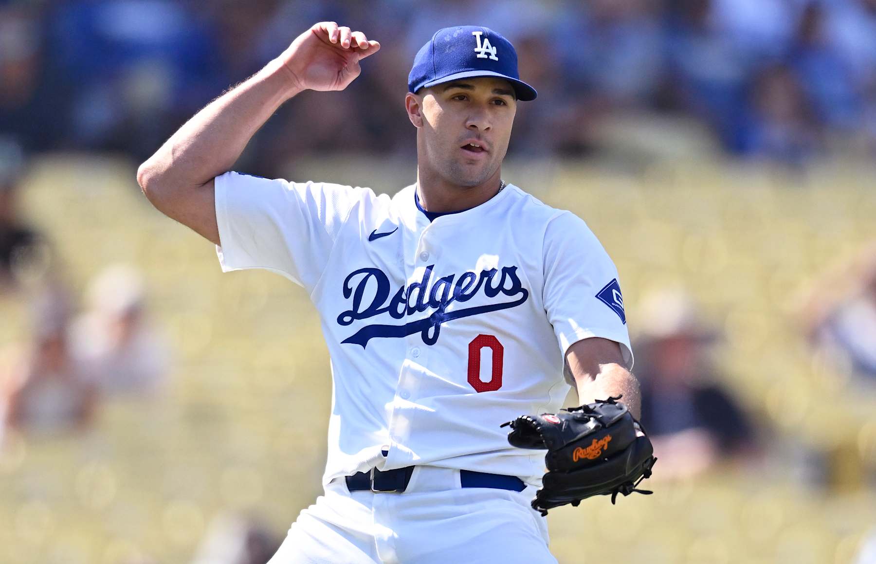 LOS ANGELES, CALIFORNIA - SEPTEMBER 8: Jack Flaherty #0 of the Los Angeles Dodgers makes a throw to first base while playing the Cleveland Guardians at Dodger Stadium on September 8, 2024 in Los Angeles, California. (Photo by John McCoy/Getty Images)