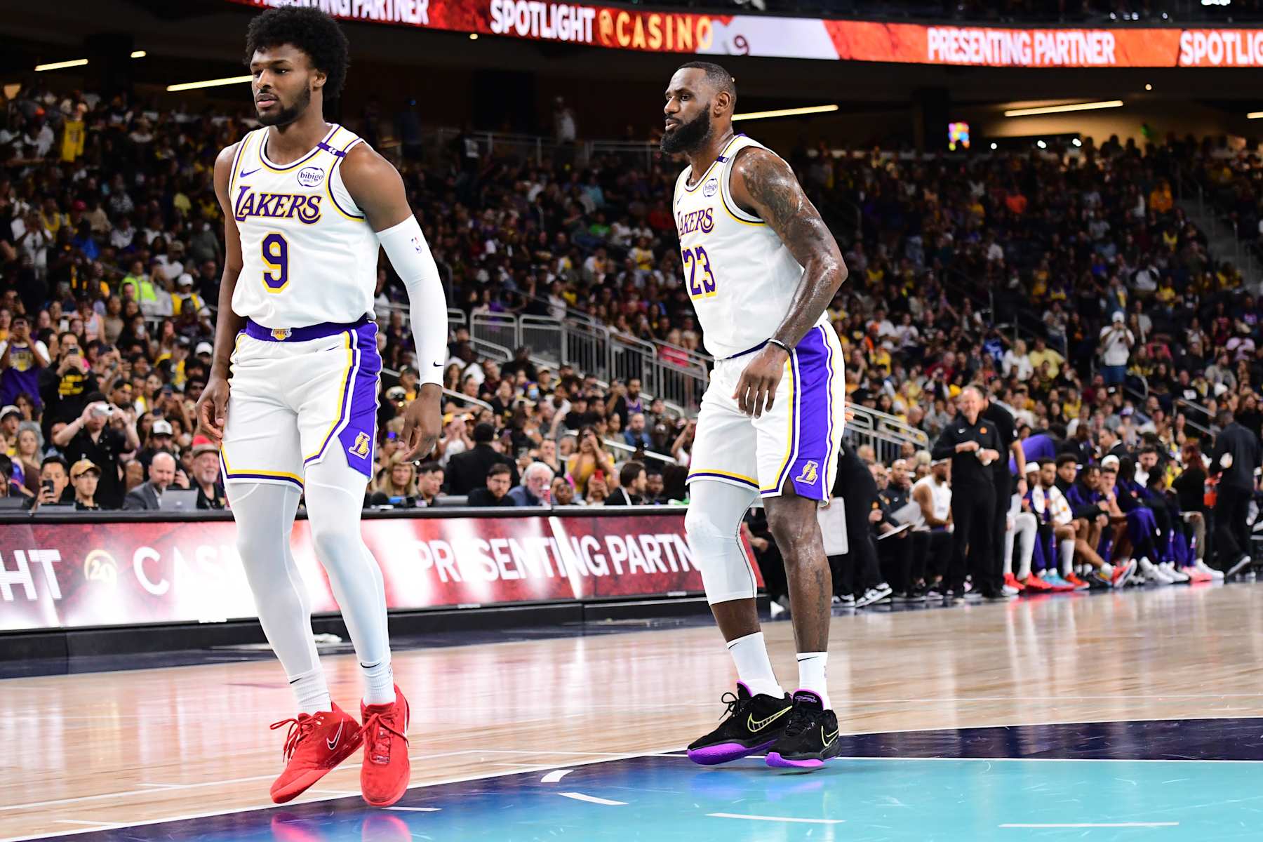 LOS ANGELES, CA - OCTOBER 6: Bronny James #9 and LeBron James #23 of the Los Angeles Lakers look on during the game against the Phoenix Suns on October 6, 2024 at Acrisure Arena in Palm Springs, California. NOTE TO USER: User expressly acknowledges and agrees that, by downloading and/or using this Photograph, user is consenting to the terms and conditions of the Getty Images License Agreement. Mandatory Copyright Notice: Copyright 2024 NBAE (Photo by Adam Pantozzi/NBAE via Getty Images)