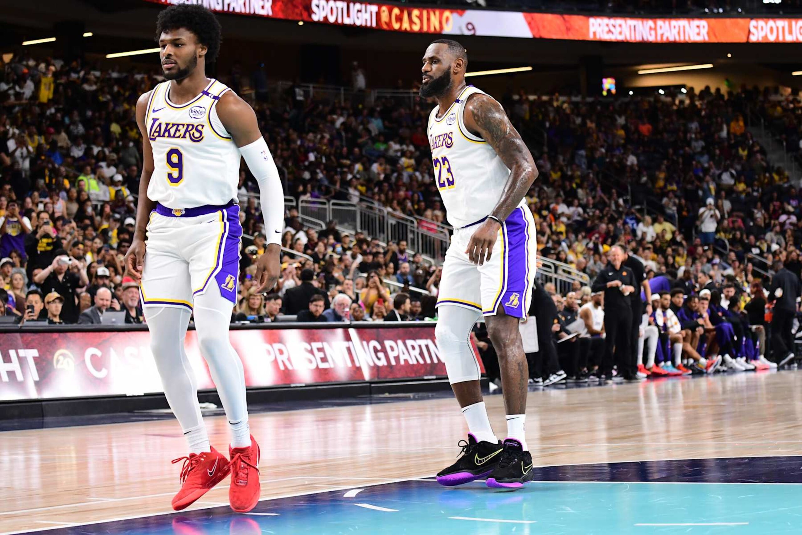 LOS ANGELES, CA - OCTOBER 6: Bronny James #9 and LeBron James #23 of the Los Angeles Lakers look on during the game against the Phoenix Suns on October 6, 2024 at Acrisure Arena in Palm Springs, California. NOTE TO USER: User expressly acknowledges and agrees that, by downloading and/or using this Photograph, user is consenting to the terms and conditions of the Getty Images License Agreement. Mandatory Copyright Notice: Copyright 2024 NBAE (Photo by Adam Pantozzi/NBAE via Getty Images)