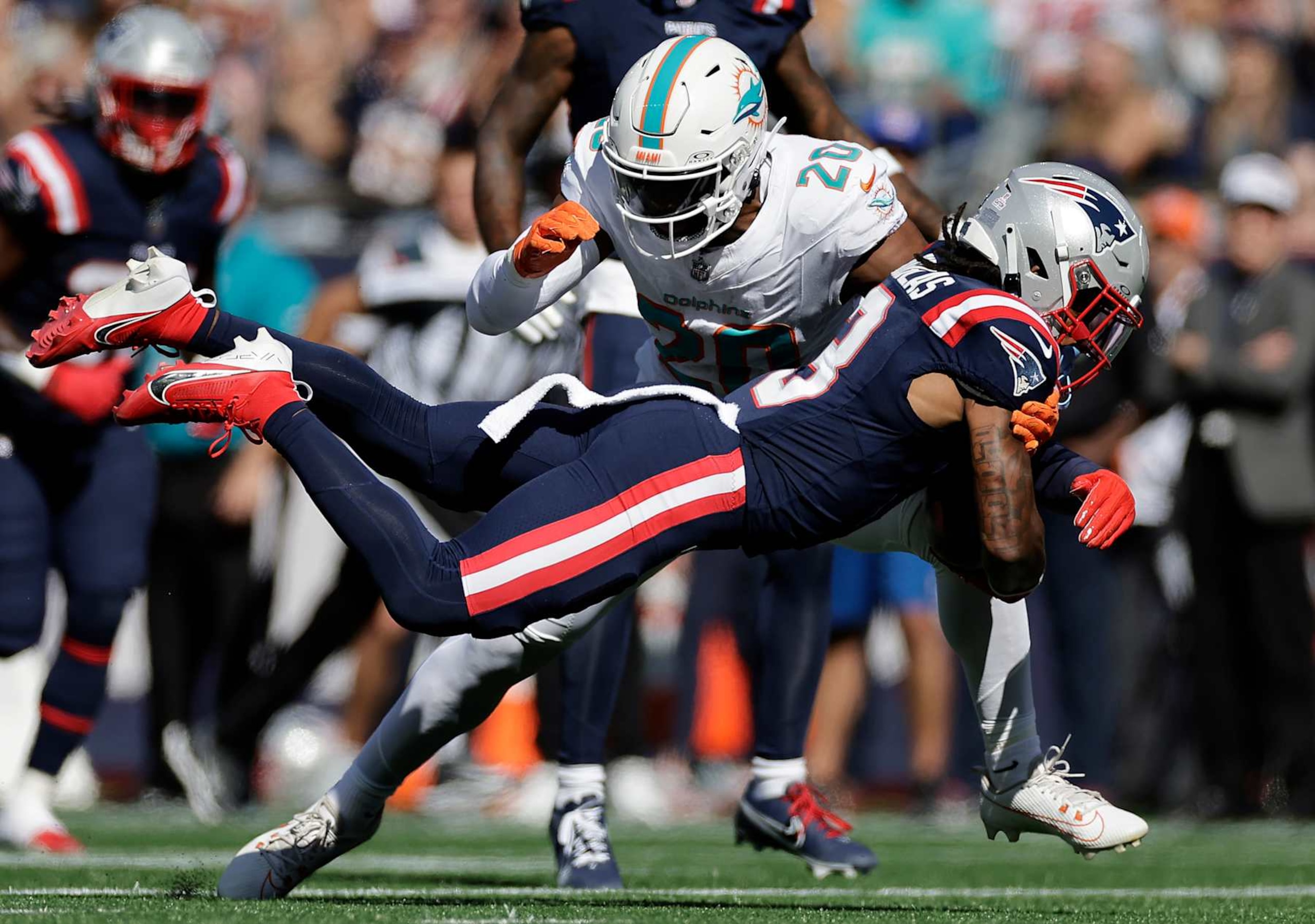 FOXBOROUGH, MASSACHUSETTS - OCTOBER 06: DeMario Douglas #3 of the New England Patriots dives with the ball during the second quarter against the Miami Dolphins at Gillette Stadium on October 06, 2024 in Foxborough, Massachusetts. (Photo by Adam Hunger/Getty Images)