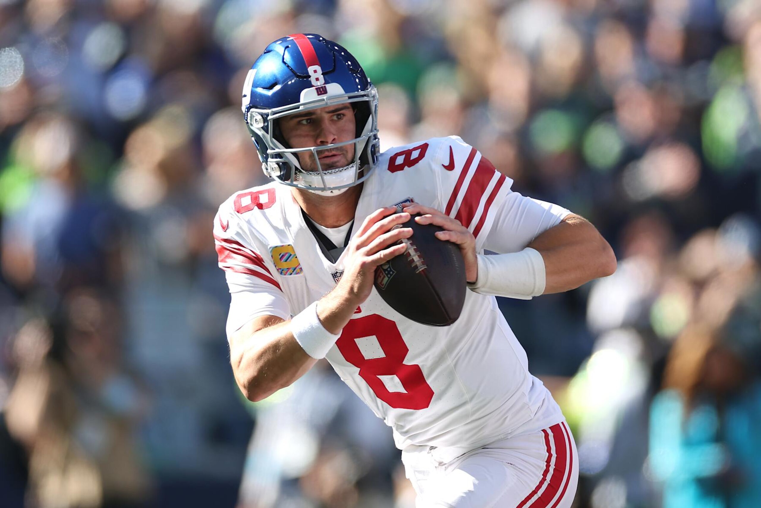SEATTLE, WASHINGTON - OCTOBER 06: Daniel Jones #8 of the New York Giants looks to pass during the first quarter against the Seattle Seahawks at Lumen Field on October 06, 2024 in Seattle, Washington. (Photo by Steph Chambers/Getty Images)