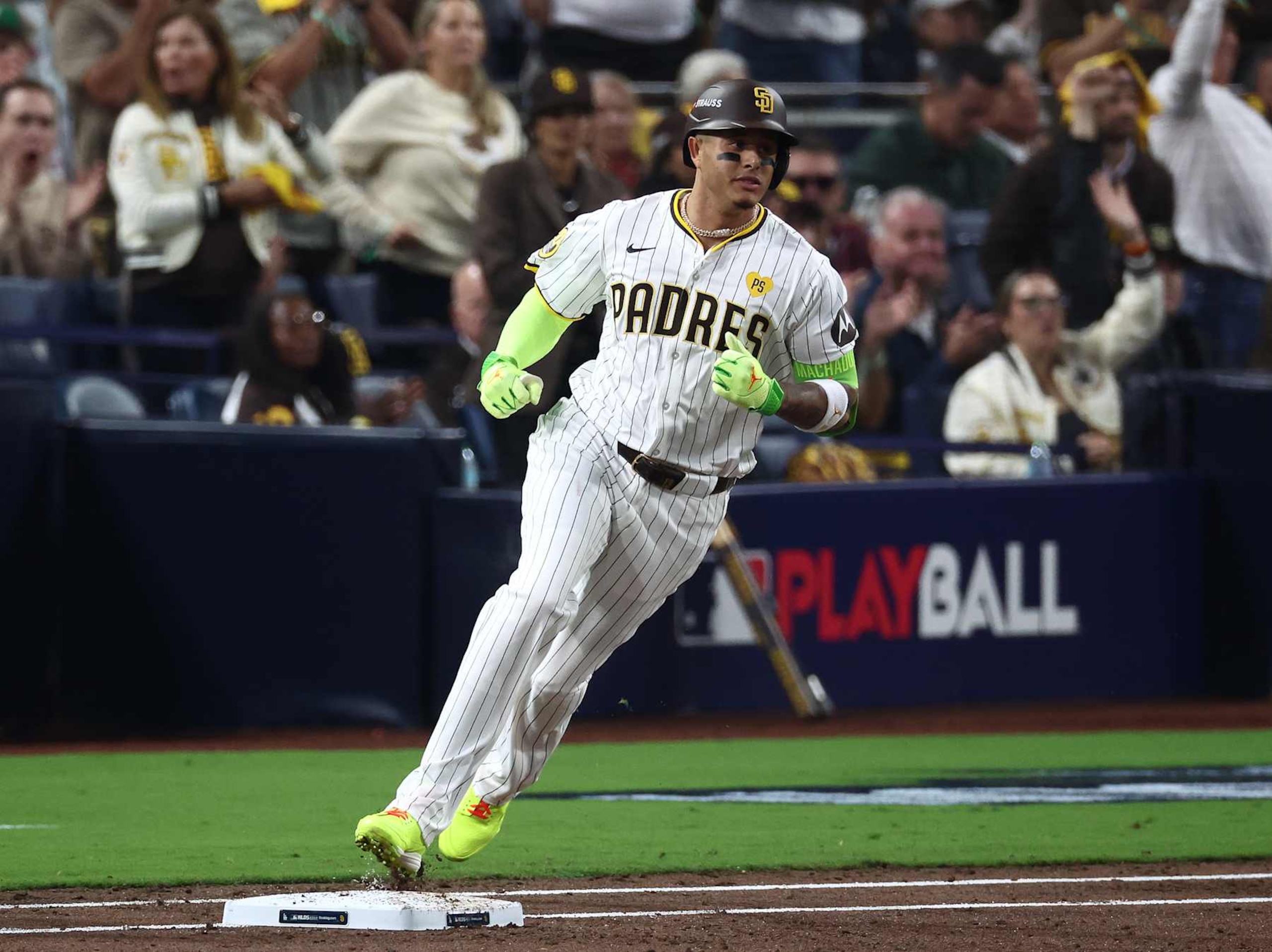 SAN DIEGO, CALIFORNIA - OCTOBER 08: Manny Machado #13 of the San Diego Padres reaches first base for a single in the second inning against the Los Angeles Dodgers during Game Three of the Division Series at Petco Park on October 08, 2024 in San Diego, California. (Photo by Katelyn Mulcahy/Getty Images) SAN DIEGO, CALIFORNIA - OCTOBER 08: Manny Machado #13 of the San Diego Padres reaches first base for a single in the second inning against the Los Angeles Dodgers during Game Three of the Division Series at Petco Park on October 08, 2024 in San Diego, California. (Photo by Katelyn Mulcahy/Getty Images)