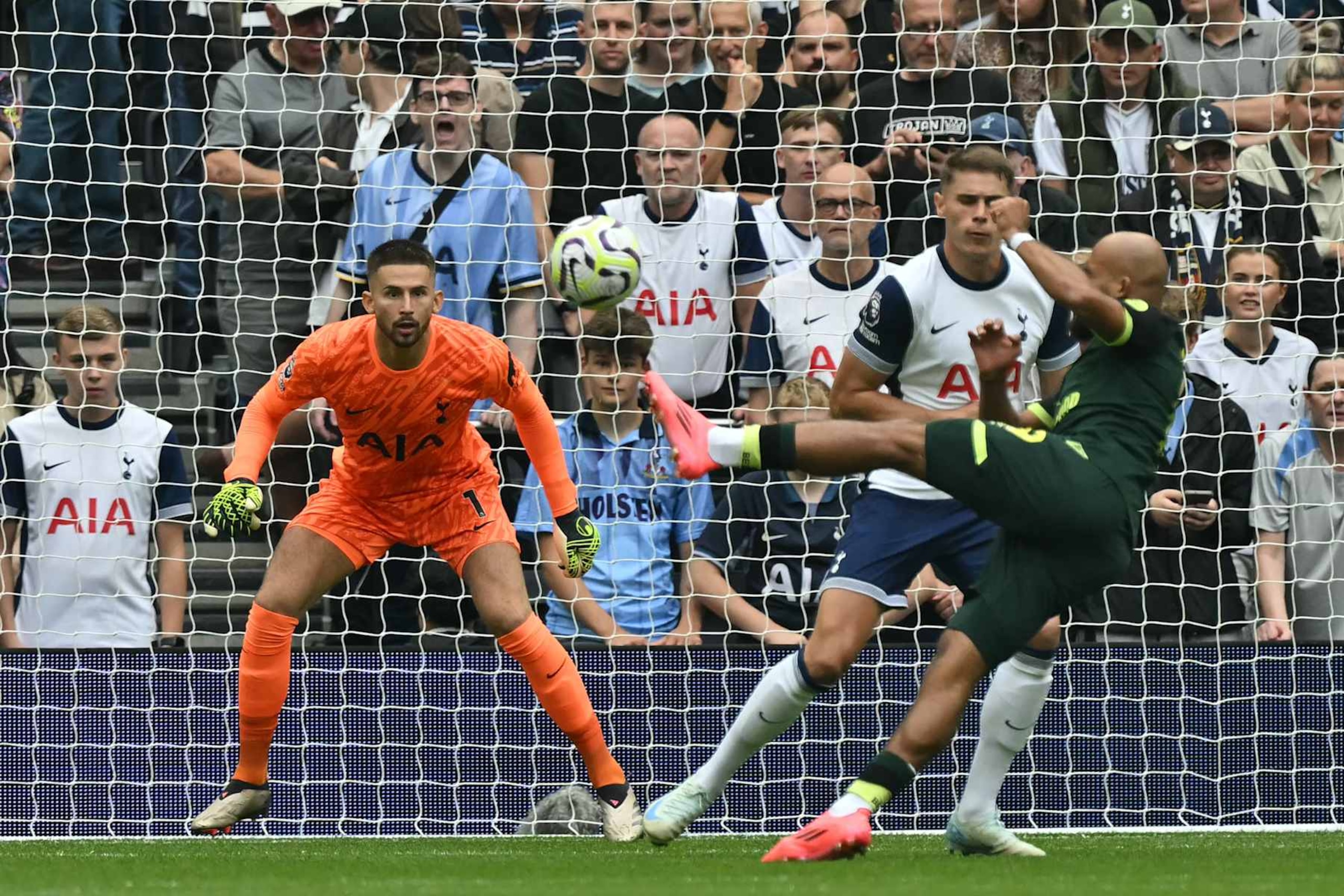 Brentford's French-born Cameroonian striker #19 Bryan Mbeumo shoots to score the opening goal of the English Premier League football match between Tottenham Hotspur and Brentford at the Tottenham Hotspur Stadium in London, on September 21, 2024. (Photo by Glyn KIRK / AFP) / RESTRICTED TO EDITORIAL USE. No use with unauthorized audio, video, data, fixture lists, club/league logos or 'live' services. Online in-match use limited to 120 images. An additional 40 images may be used in extra time. No video emulation. Social media in-match use limited to 120 images. An additional 40 images may be used in extra time. No use in betting publications, games or single club/league/player publications. /  (Photo by GLYN KIRK/AFP via Getty Images)