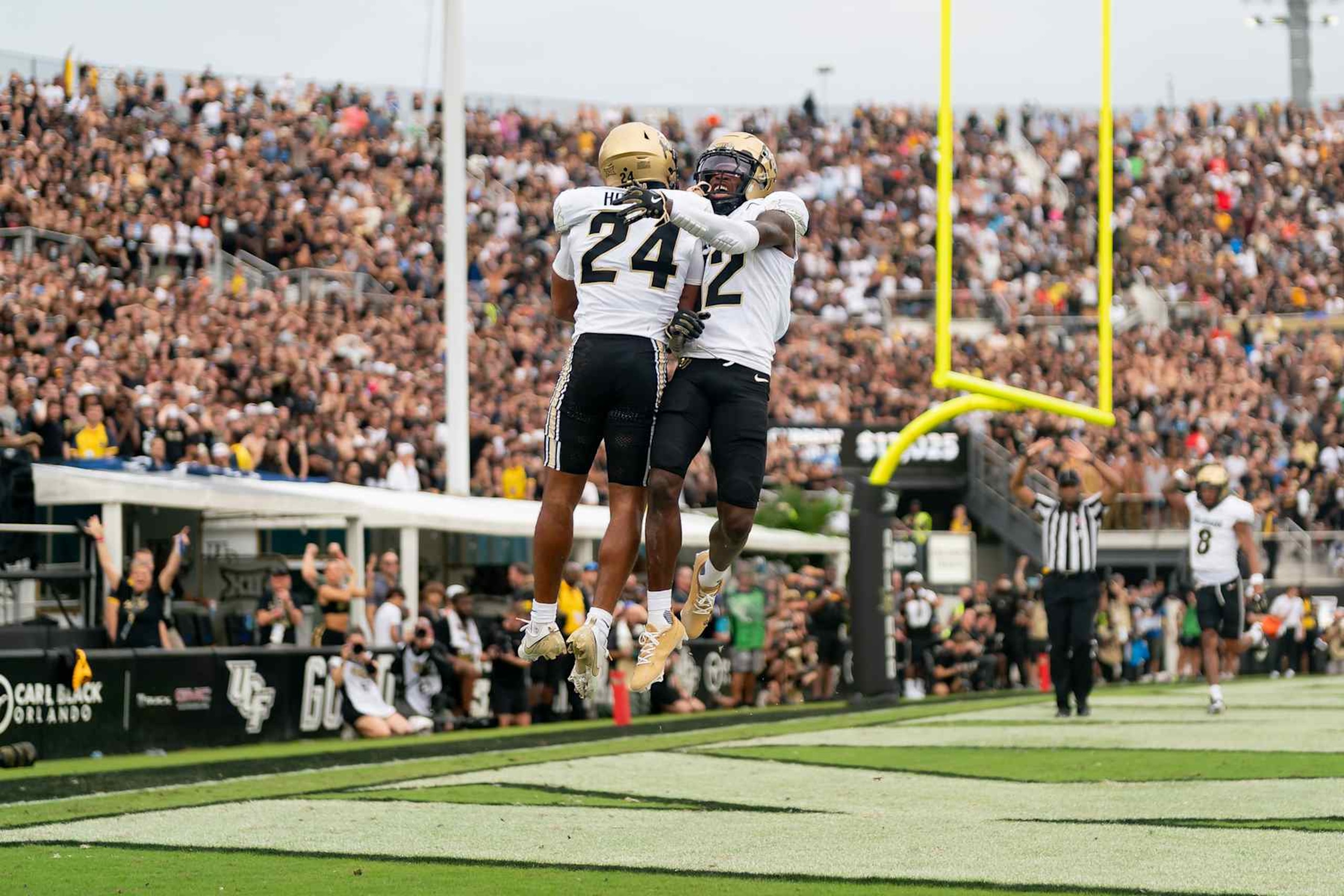 ORLANDO, FL - SEPTEMBER 28:  Colorado Buffaloes cornerback Preston Hodge (24) and Colorado Buffaloes wide receiver Travis Hunter (12) celebrate an interception during a college football game between the Colorado Buffaloes and the UCF Knights on September 28th, 2024 at FBC Mortgage Stadium in Orlando, FL. (Photo by Chris Leduc/Icon Sportswire via Getty Images)
