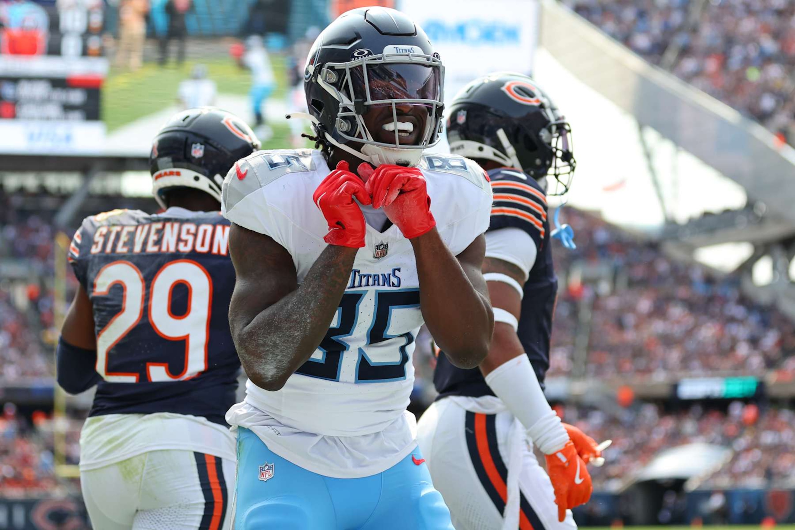 CHICAGO, ILLINOIS - SEPTEMBER 08: Chigoziem Okonkwo #85 of the Tennessee Titans celebrates after scoring a touchdown in the second quarter of the game against the Chicago Bears at Soldier Field on September 08, 2024 in Chicago, Illinois. (Photo by Stacy Revere/Getty Images)