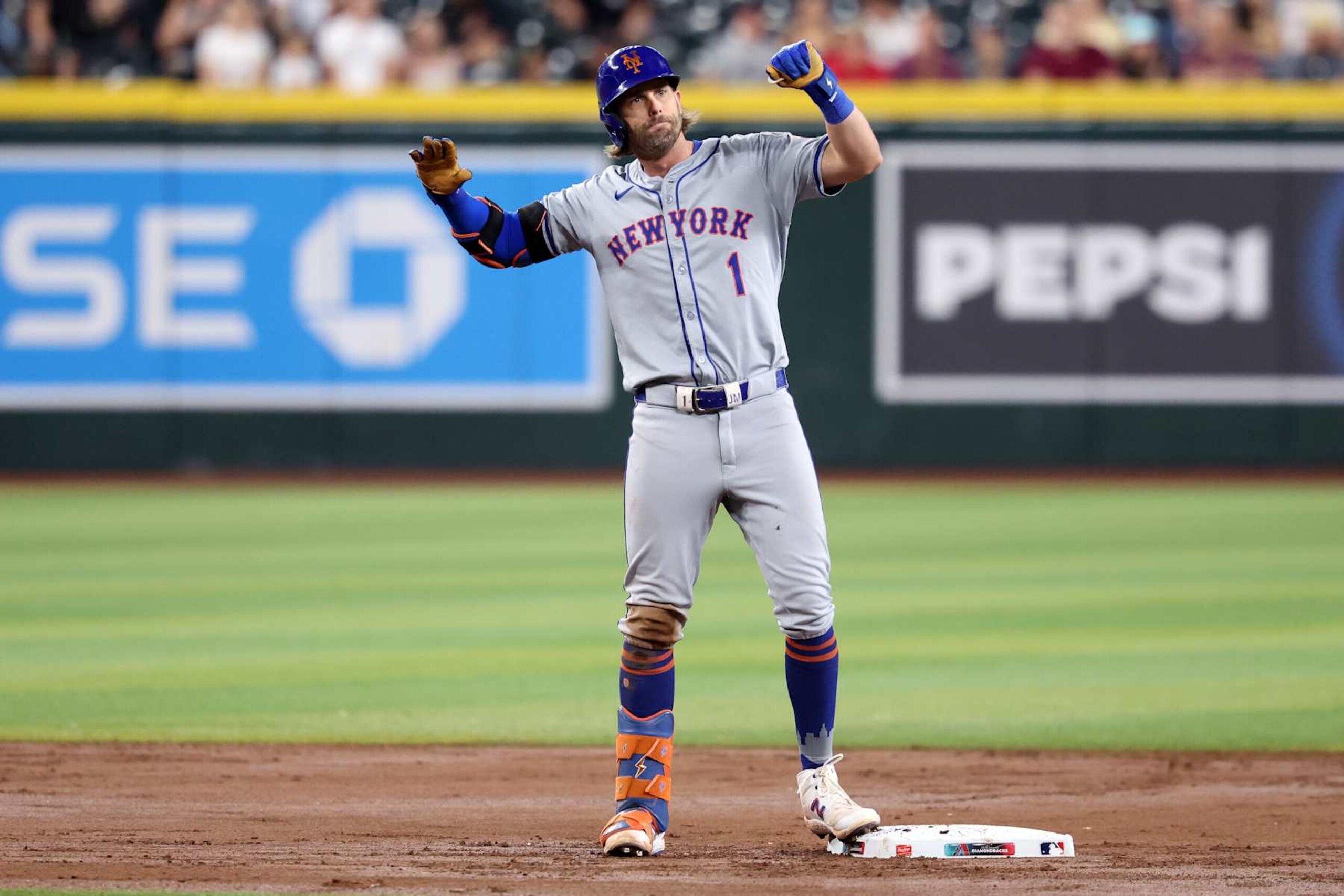 PHOENIX, ARIZONA - AUGUST 29: Jeff McNeil #1 of the New York Mets reacts after hitting a double during the game against the Arizona Diamondbacks at Chase Field on August 29, 2024 in Phoenix, Arizona. The Mets defeated the Diamondbacks 3-2.  (Photo by Chris Coduto/Getty Images)