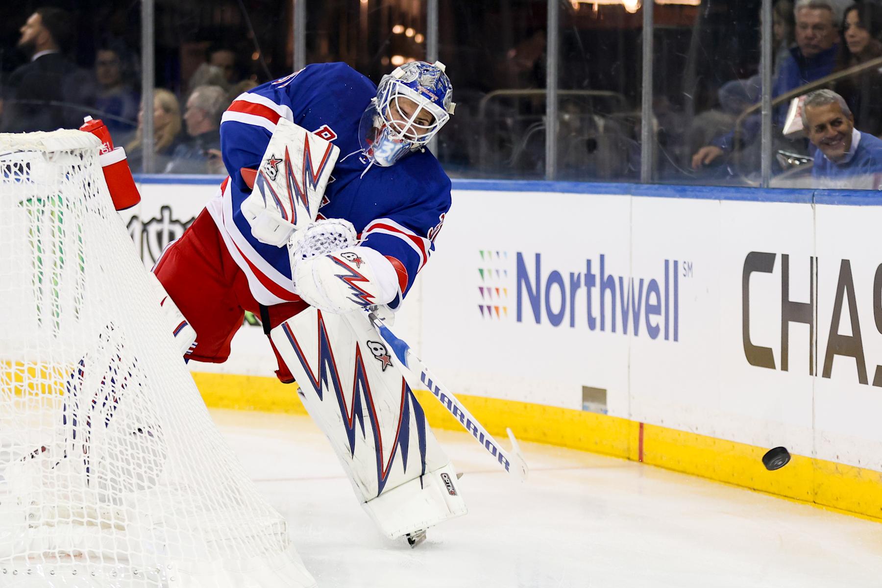 NEW YORK, NY - SEPTEMBER 24: New York Rangers Goalie Igor Shesterkin (31) clears the puck behind the net during the first period of the National Hockey League preseason game between the New York Islanders and the New York Rangers on September 24, 2024 at Madison Square Garden in New York, NY. (Photo by Joshua Sarner/Icon Sportswire via Getty Images)