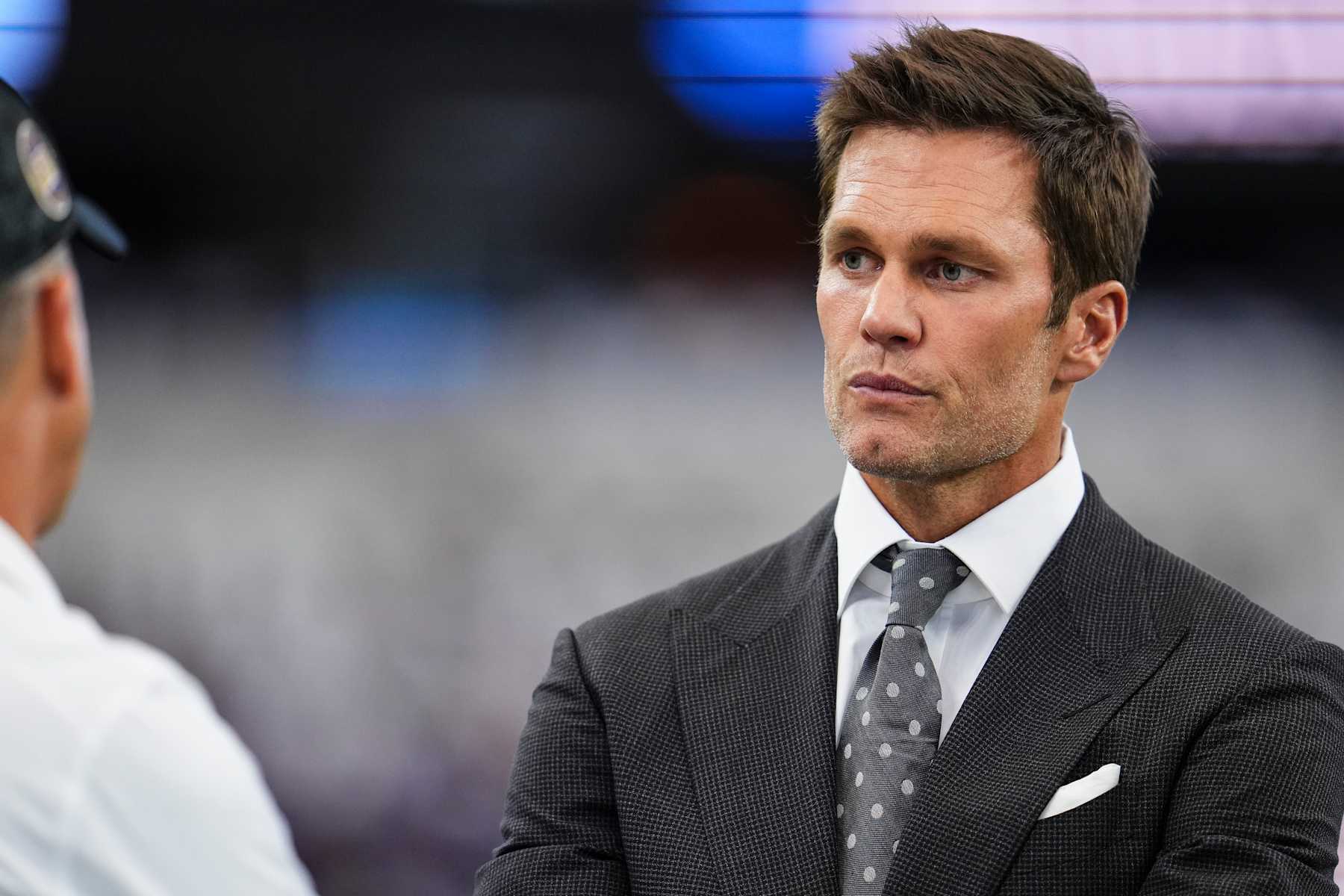 ARLINGTON, TX - SEPTEMBER 22: Tom Brady looks on prior to an NFL football game between the Baltimore Ravens and the Dallas Cowboys at AT&T Stadium on September 22, 2024 in Arlington, Texas. (Photo by Cooper Neill/Getty Images) ARLINGTON, TX - SEPTEMBER 22: Tom Brady looks on prior to an NFL football game between the Baltimore Ravens and the Dallas Cowboys at AT&T Stadium on September 22, 2024 in Arlington, Texas. (Photo by Cooper Neill/Getty Images)