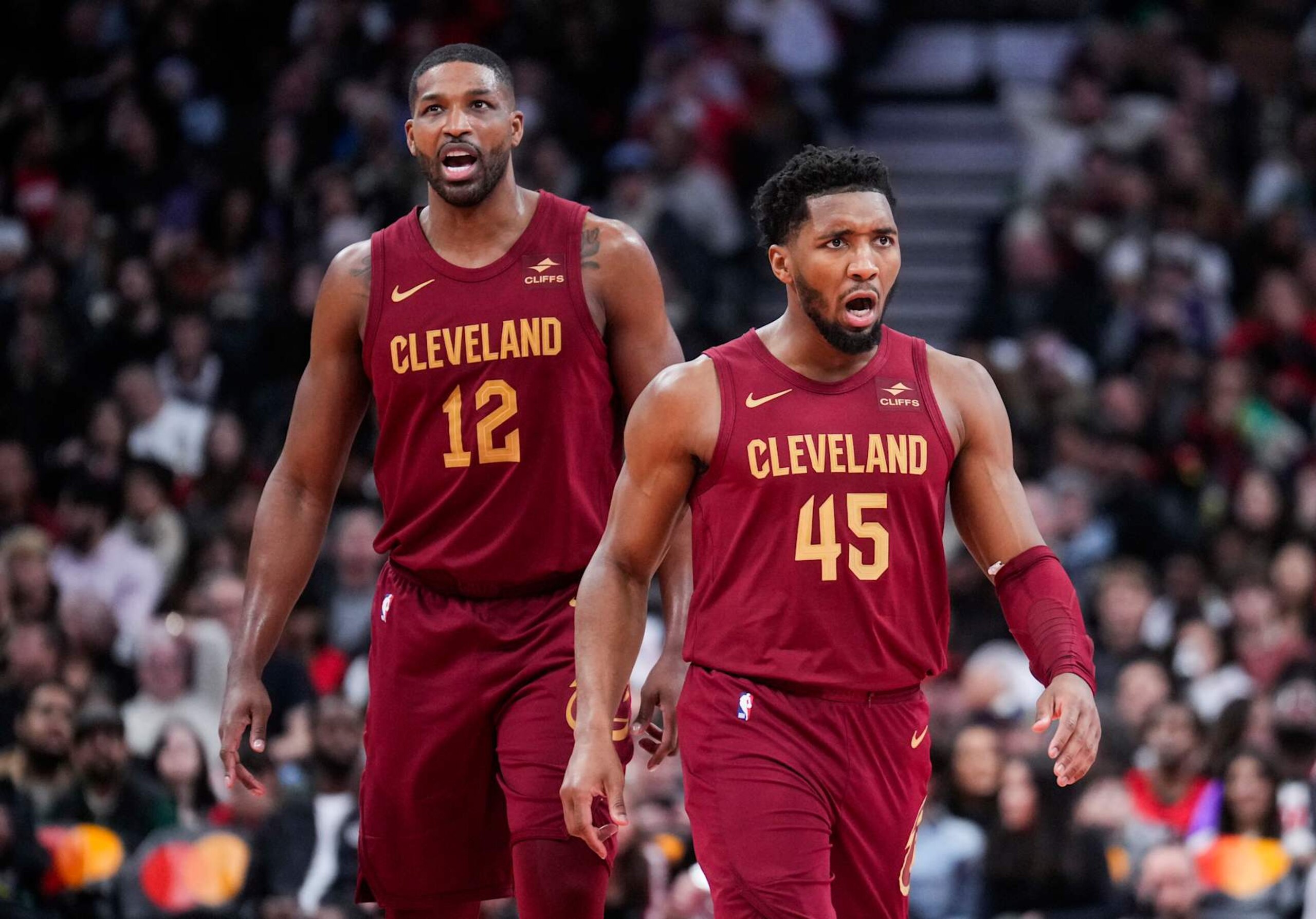 TORONTO, ON - JANUARY 1: Tristan Thompson #12 and Donovan Mitchell #45 of Cleveland Cavaliers celebrate against the Toronto Raptors during the second half of their basketball game at the Scotiabank Arena on January 1, 2024 in Toronto, Ontario, Canada. NOTE TO USER: User expressly acknowledges and agrees that, by downloading and/or using this Photograph, user is consenting to the terms and conditions of the Getty Images License Agreement. (Photo by Mark Blinch/Getty Images) TORONTO, ON - JANUARY 1: Tristan Thompson #12 and Donovan Mitchell #45 of Cleveland Cavaliers celebrate against the Toronto Raptors during the second half of their basketball game at the Scotiabank Arena on January 1, 2024 in Toronto, Ontario, Canada. NOTE TO USER: User expressly acknowledges and agrees that, by downloading and/or using this Photograph, user is consenting to the terms and conditions of the Getty Images License Agreement. (Photo by Mark Blinch/Getty Images)