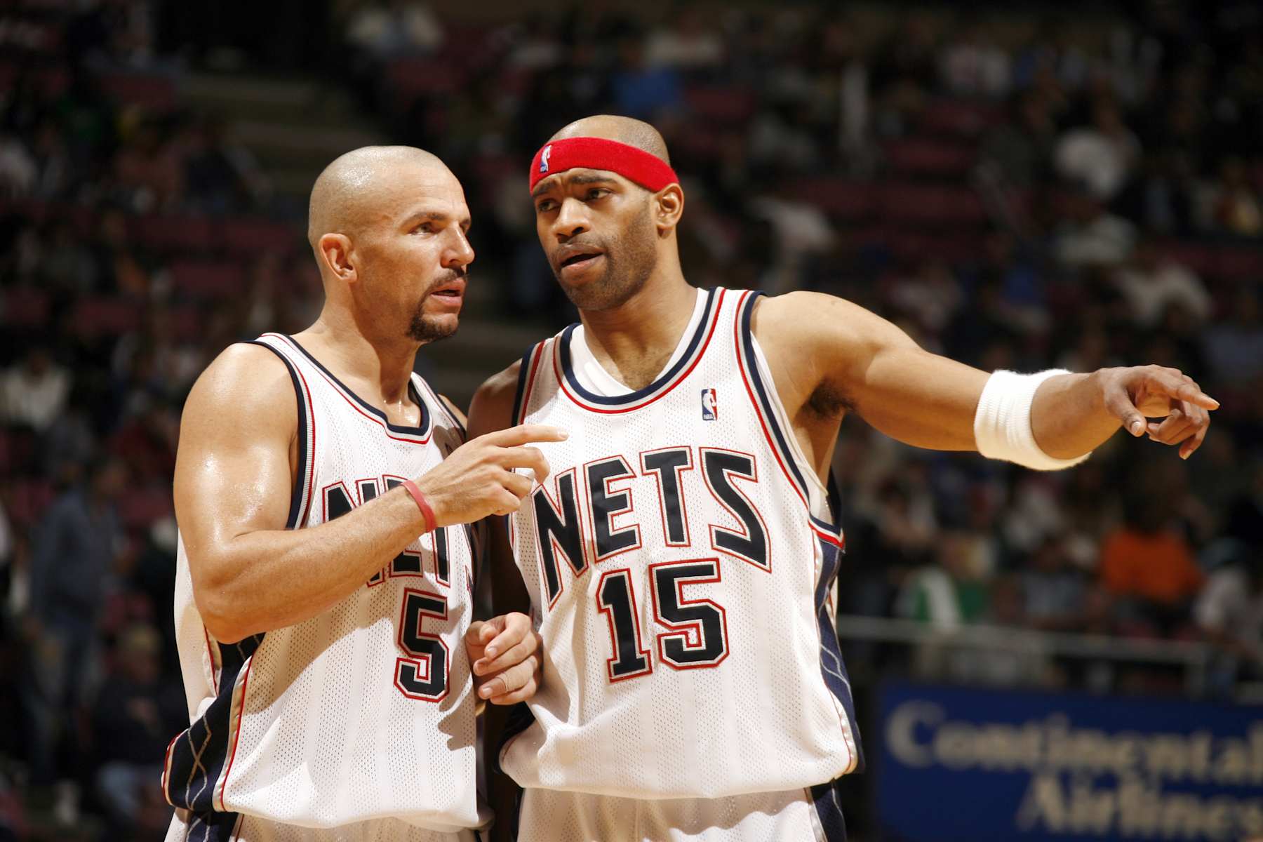 EAST RUTHERFORD, NJ - MAY 14:  Jason Kidd #5 of the New Jersey Nets talks with his teammate Vince Carter #15 in game four of the Eastern Conference Semifinals against the Miami Heat during the 2006 NBA Playoffs on May 14, 2006 at the Continental Airlines Arena in East Rutherford, New Jersey.  The Heat won 102-92.  NOTE TO USER: User expressly acknowledges and agrees that, by downloading and or using this photograph, User is consenting to the terms and conditions of the Getty Images License Agreement. Mandatory Copyright Notice: Copyright 2005 NBAE (Photo by Nathaniel S. Butler/NBAE via Getty Images)