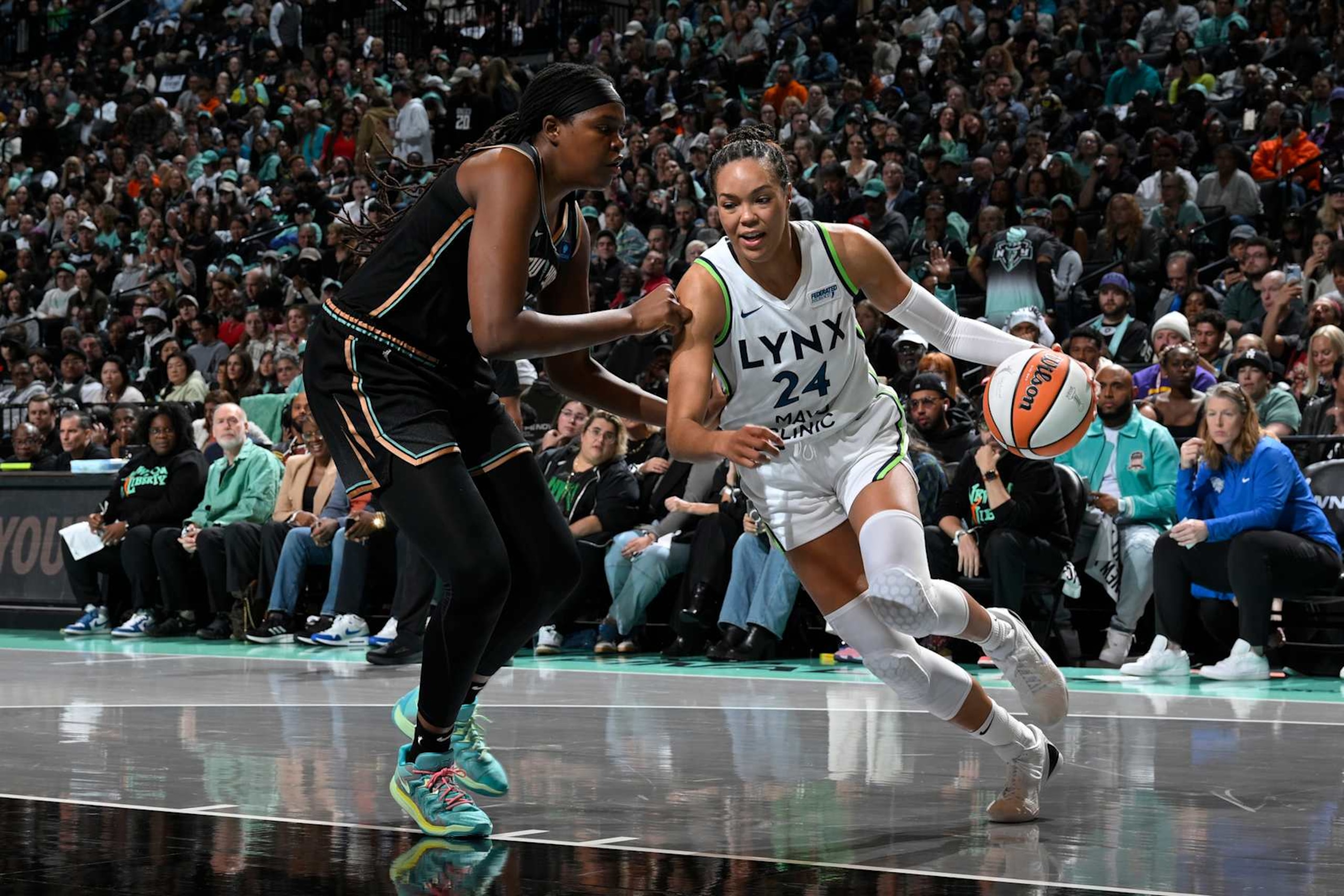 BROOKLYN, NY - OCTOBER 10: Napheesa Collier #24 of the Minnesota Lynx dribbles the ball during the game against the New York Liberty during Game 1 of the 2024 WNBA Finals on October 10, 2024 at Barclays Center in Brooklyn, New York. NOTE TO USER: User expressly acknowledges and agrees that, by downloading and or using this photograph, User is consenting to the terms and conditions of the Getty Images License Agreement. Mandatory Copyright Notice: Copyright 2024 NBAE (Photo by David Dow/NBAE via Getty Images) BROOKLYN, NY - OCTOBER 10: Napheesa Collier #24 of the Minnesota Lynx dribbles the ball during the game against the New York Liberty during Game 1 of the 2024 WNBA Finals on October 10, 2024 at Barclays Center in Brooklyn, New York. NOTE TO USER: User expressly acknowledges and agrees that, by downloading and or using this photograph, User is consenting to the terms and conditions of the Getty Images License Agreement. Mandatory Copyright Notice: Copyright 2024 NBAE (Photo by David Dow/NBAE via Getty Images)