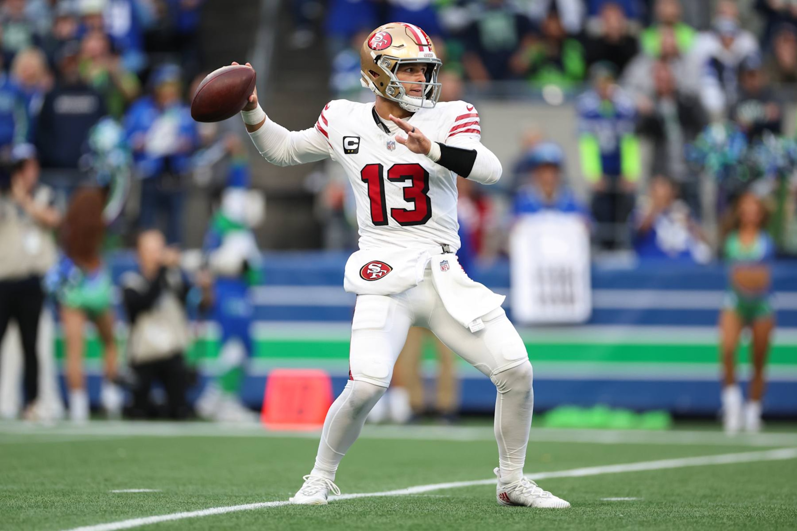 SEATTLE, WASHINGTON - OCTOBER 10: Brock Purdy #13 of the San Francisco 49ers throws the ball during the first quarter against the Seattle Seahawks at Lumen Field on October 10, 2024 in Seattle, Washington. (Photo by Steph Chambers/Getty Images)