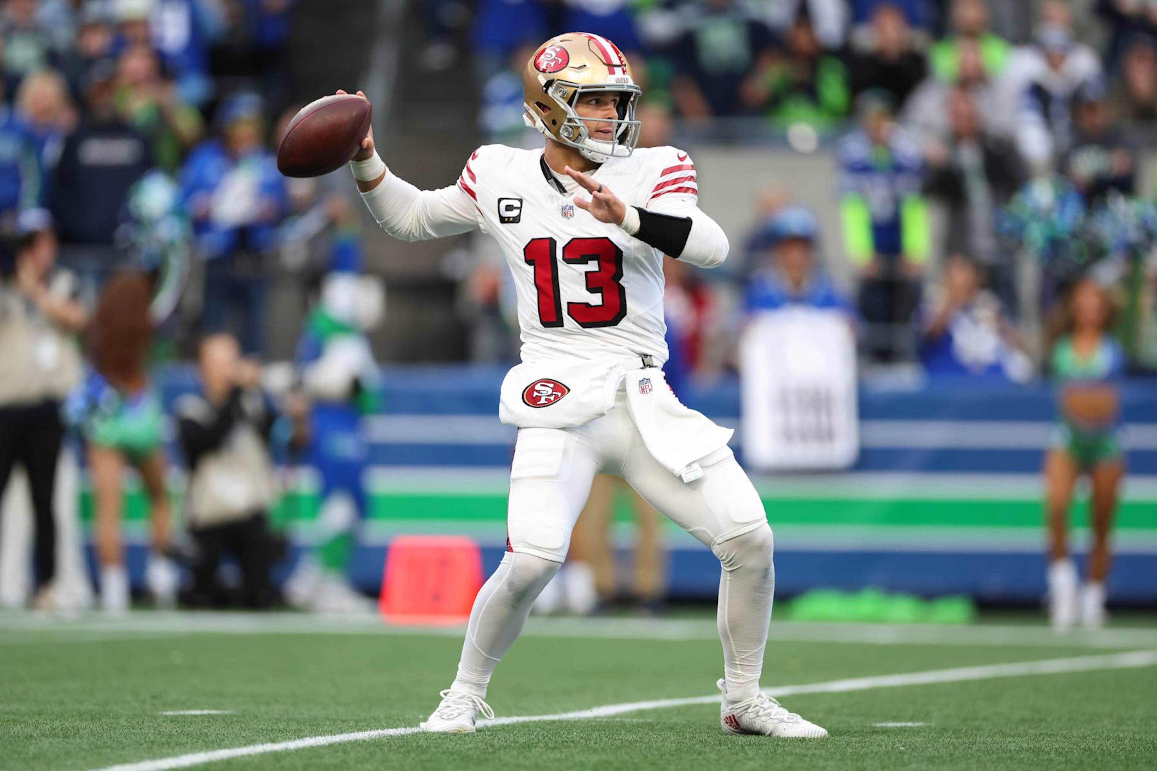 SEATTLE, WASHINGTON - OCTOBER 10: Brock Purdy #13 of the San Francisco 49ers throws the ball during the first quarter against the Seattle Seahawks at Lumen Field on October 10, 2024 in Seattle, Washington. (Photo by Steph Chambers/Getty Images)