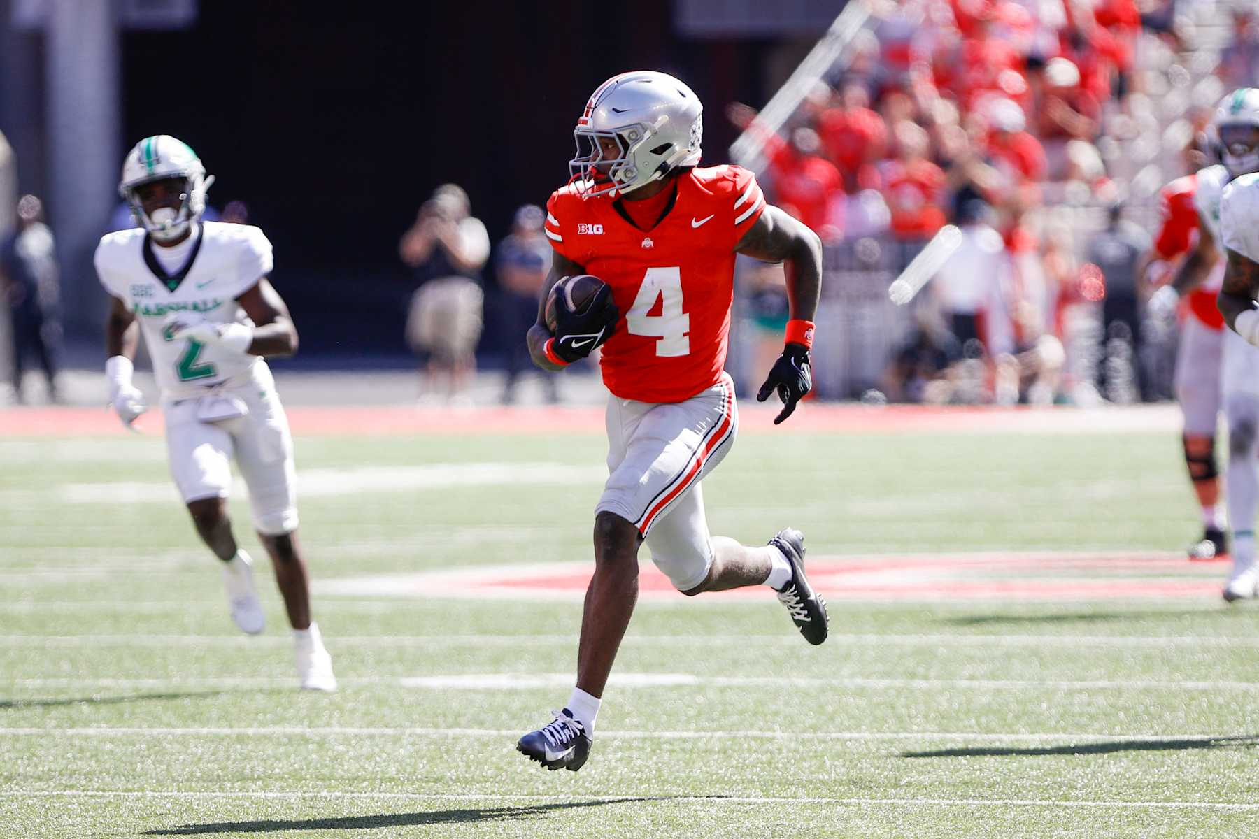 COLUMBUS, OH - SEPTEMBER 21: Ohio State Buckeyes wide receiver Jeremiah Smith (4) carries the ball for a touchdown during the game against Marshall Thundering Herd and the Ohio State Buckeyes on September 21, 2024, at Ohio Stadium in Columbus, OH. (Photo by Ian Johnson/Icon Sportswire via Getty Images)