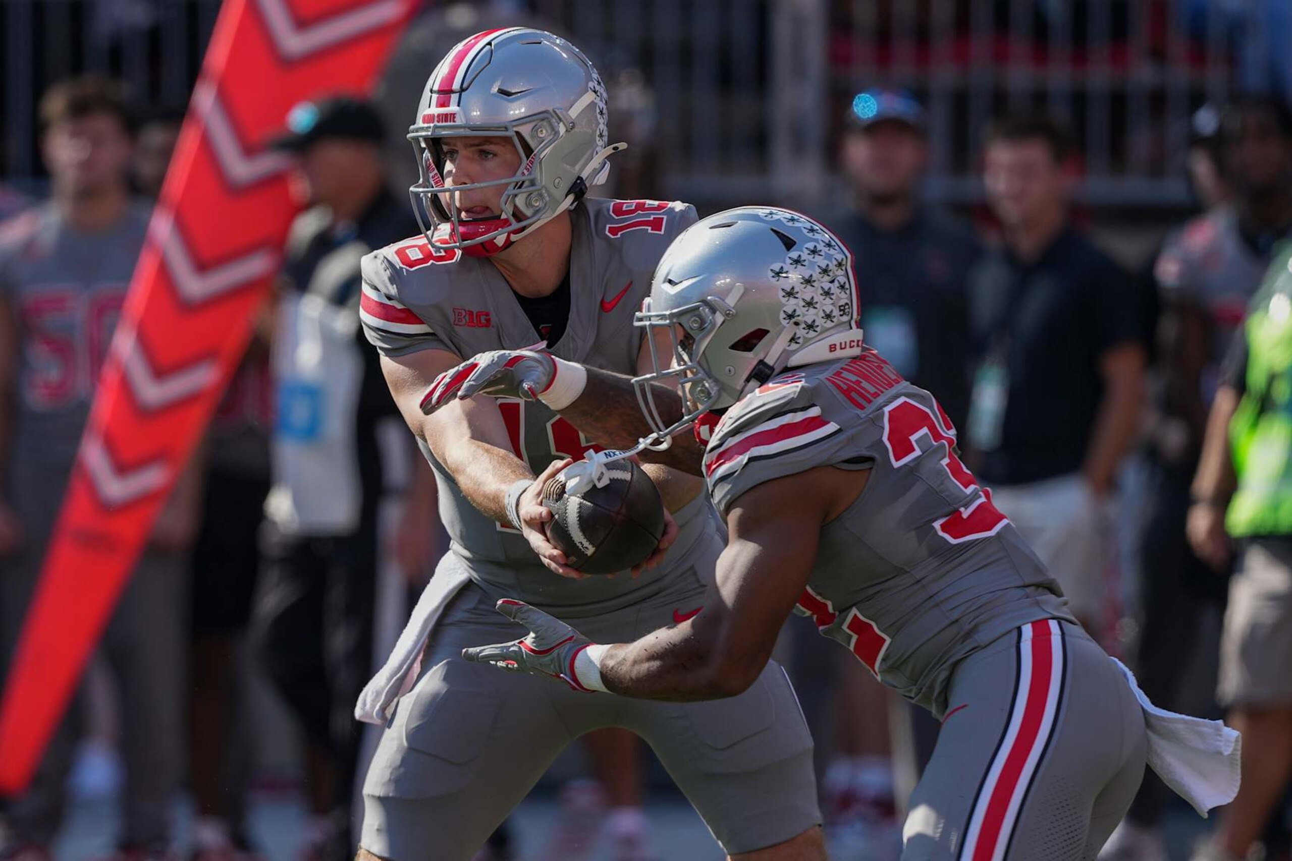 COLUMBUS, OHIO - OCTOBER 05: Quarterback Will Howard #18 of the Ohio State Buckeyes hands the ball off to running back TreVeyon Henderson #32 of the Ohio State Buckeyes during the game against the Iowa Hawkeyes at Ohio Stadium on October 05, 2024 in Columbus, Ohio. (Photo by Jason Mowry/Getty Images)