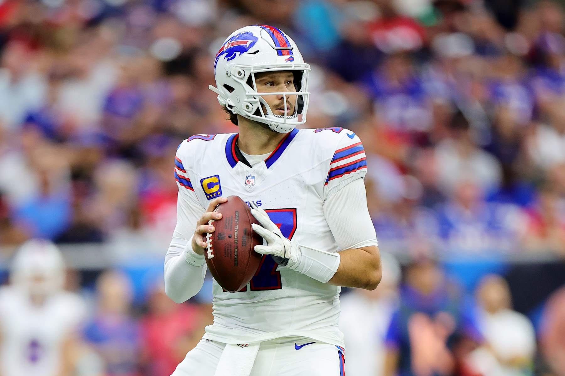 HOUSTON, TEXAS - OCTOBER 06: Josh Allen #17 of the Buffalo Bills looks to pass during the first half against the Buffalo Bills at NRG Stadium on October 06, 2024 in Houston, Texas. (Photo by Alex Slitz/Getty Images)