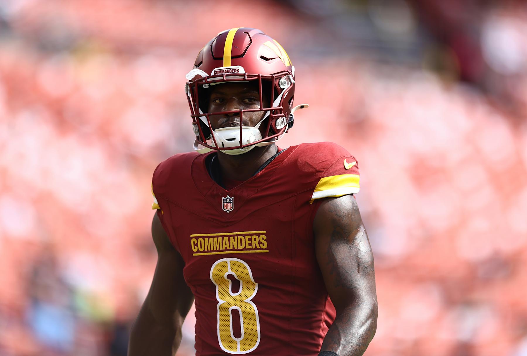 LANDOVER, MARYLAND - OCTOBER 06: Brian Robinson Jr. #8 of the Washington Commanders looks on before playing against the Cleveland Browns at Northwest Stadium on October 06, 2024 in Landover, Maryland. (Photo by Timothy Nwachukwu/Getty Images)