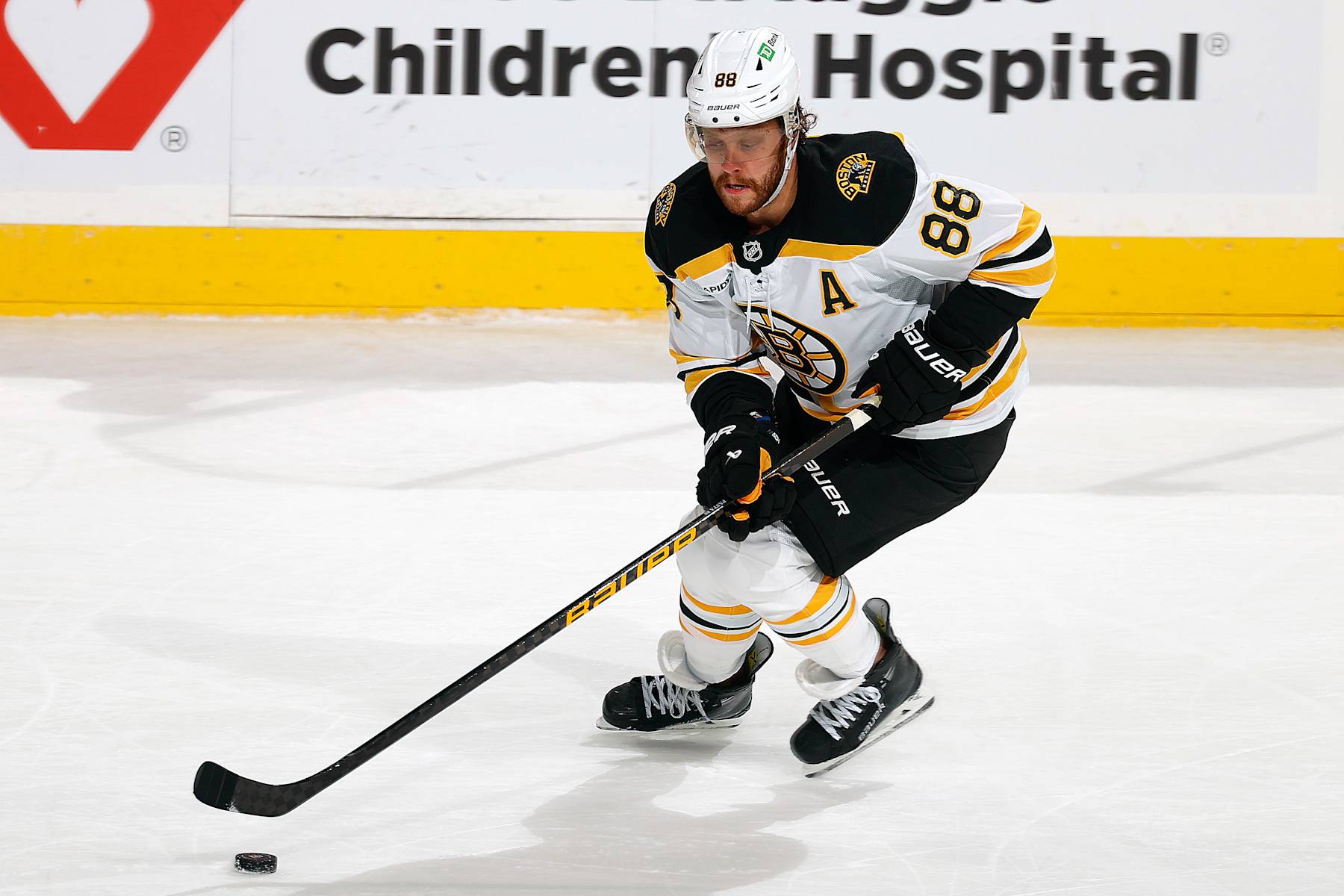 SUNRISE, FLORIDA - OCTOBER 8: David Pastrnak #88 of the Boston Bruins skates with the puck against the Florida Panthers at the Amerant Bank Arena on October 8, 2024 in Sunrise, Florida. (Photo by Eliot J. Schechter/NHLI via Getty Images)