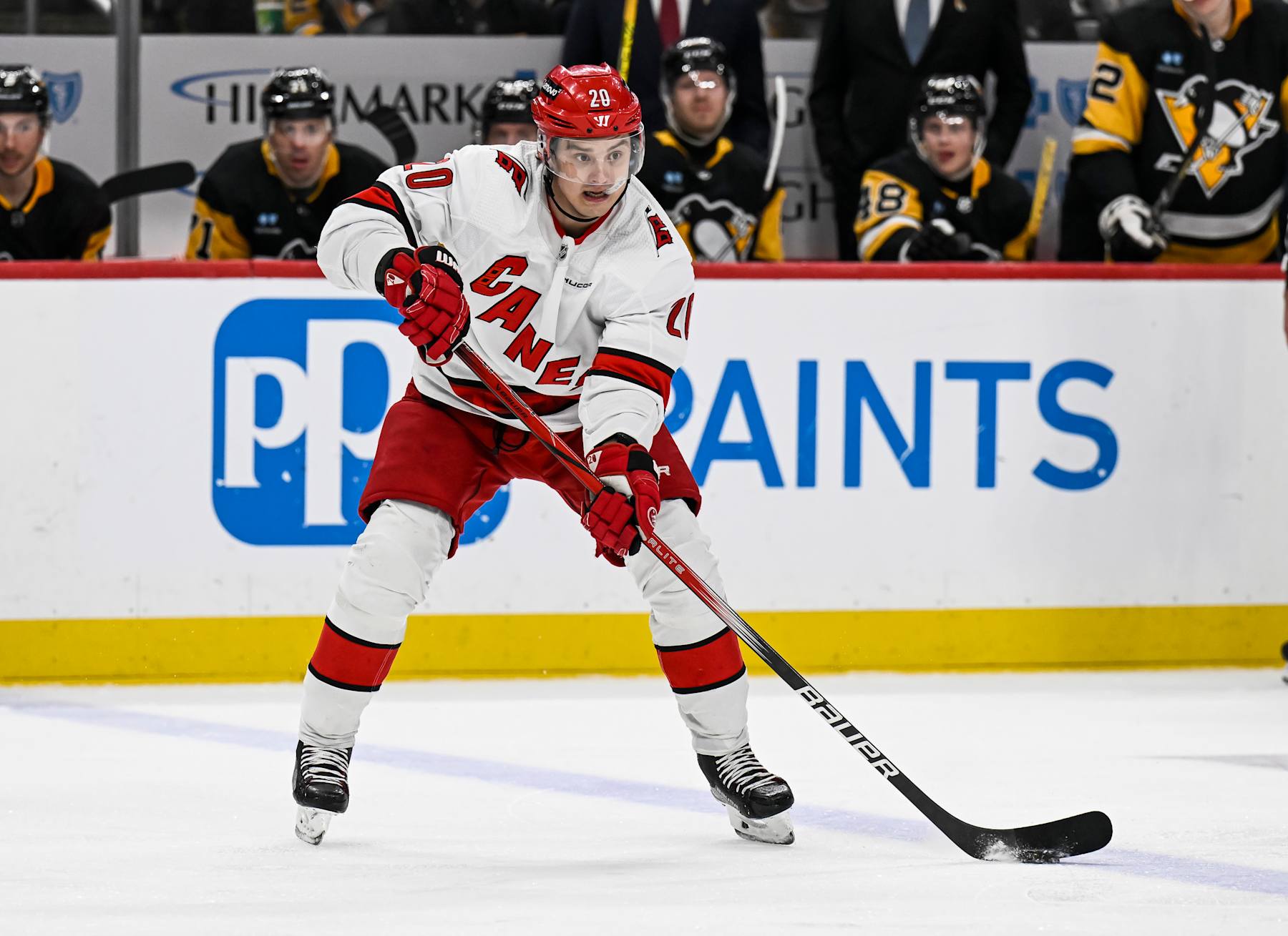 PITTSBURGH, PA - MARCH 26: Carolina Hurricanes center Sebastian Aho (20) passes the puck during the third period in the NHL game between the Pittsburgh Penguins and the Carolina Hurricanes on March 26, 2024, at PPG Paints Arena in Pittsburgh, PA. (Photo by Jeanine Leech/Icon Sportswire via Getty Images)