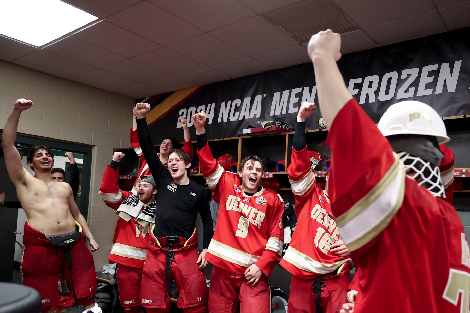 ST PAUL, MINNESOTA - APRIL 13: The Denver Pioneers celebrate their win over the Boston College Eagles during the Division I Mens Ice Hockey Championship held at Xcel Energy Center on April 13, 2024 in St Paul, Minnesota. (Photo by Tyler Schank/NCAA Photos via Getty Images)