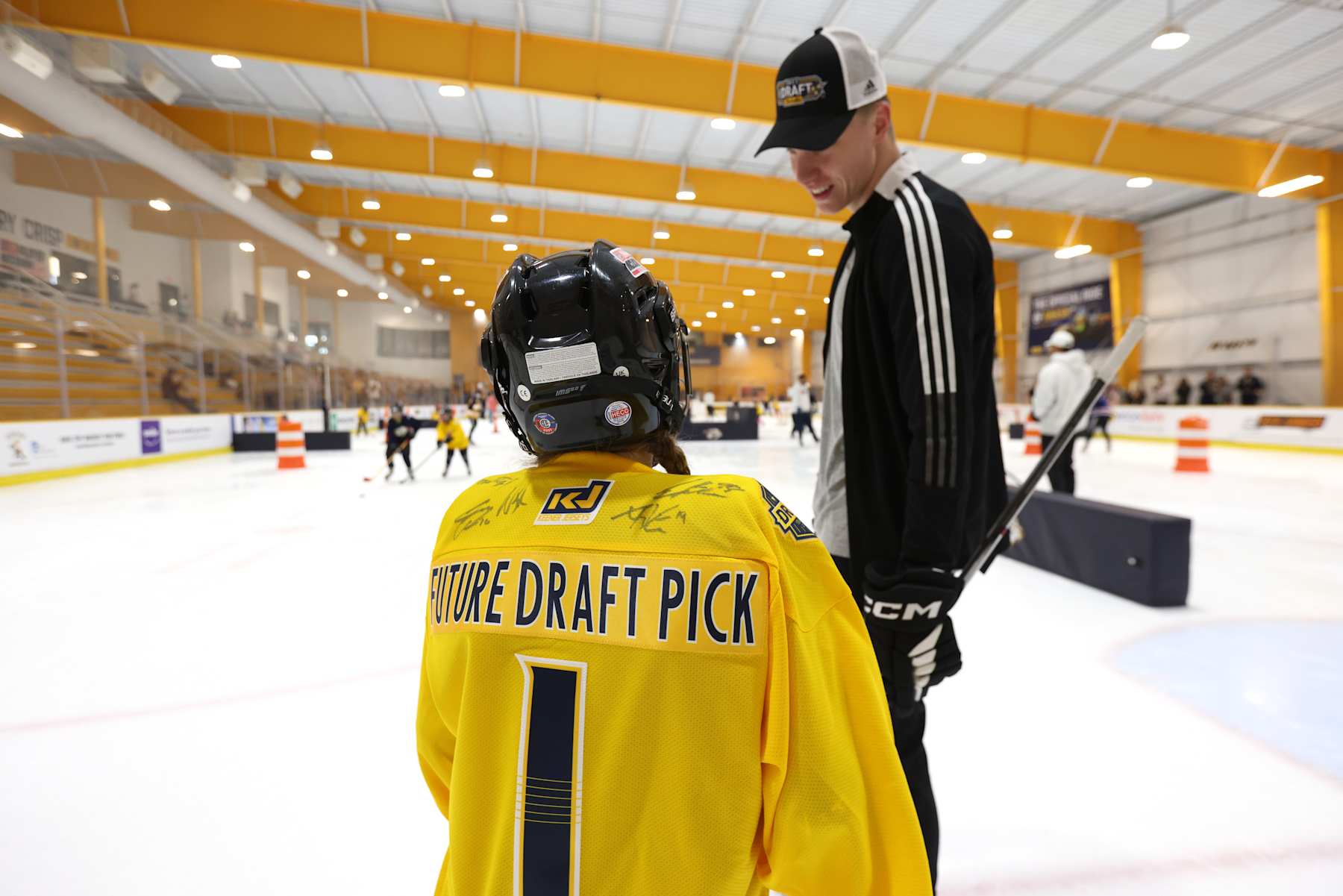 ANTIOCH, TENNESSEE - JUNE 27: Draft prospect Matthew Wood talks to a participant during the Top Prospects Youth Hockey Clinic at Ford Ice Center on June 27, 2023 in Antioch, Tennessee. (Photo by Dave Sandford/NHLI via Getty Images)