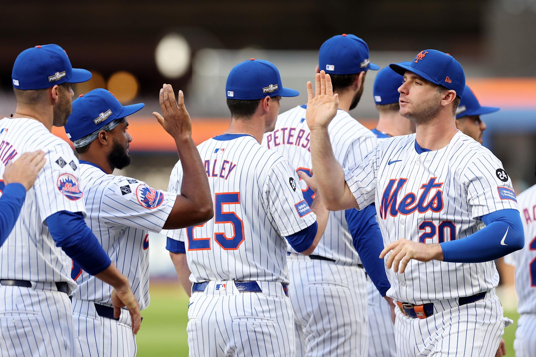 NEW YORK, NEW YORK - OCTOBER 08: Pete Alonso #20 of the New York Mets high fives teammates prior to Game Three of the Division Series against the Philadelphia Phillies at Citi Field on October 08, 2024 in New York City. (Photo by Elsa/Getty Images)