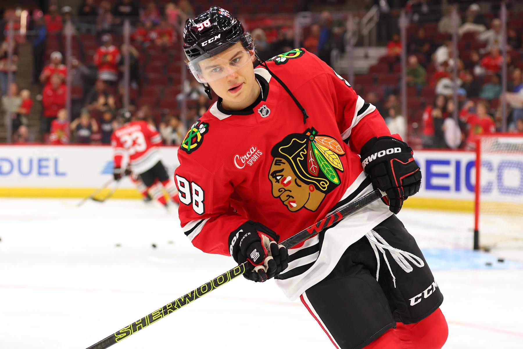 CHICAGO, ILLINOIS - OCTOBER 04: Connor Bedard #98 of the Chicago Blackhawks warms up prior to a preseason game against the Minnesota Wild at the United Center on October 04, 2024 in Chicago, Illinois. (Photo by Michael Reaves/Getty Images)
