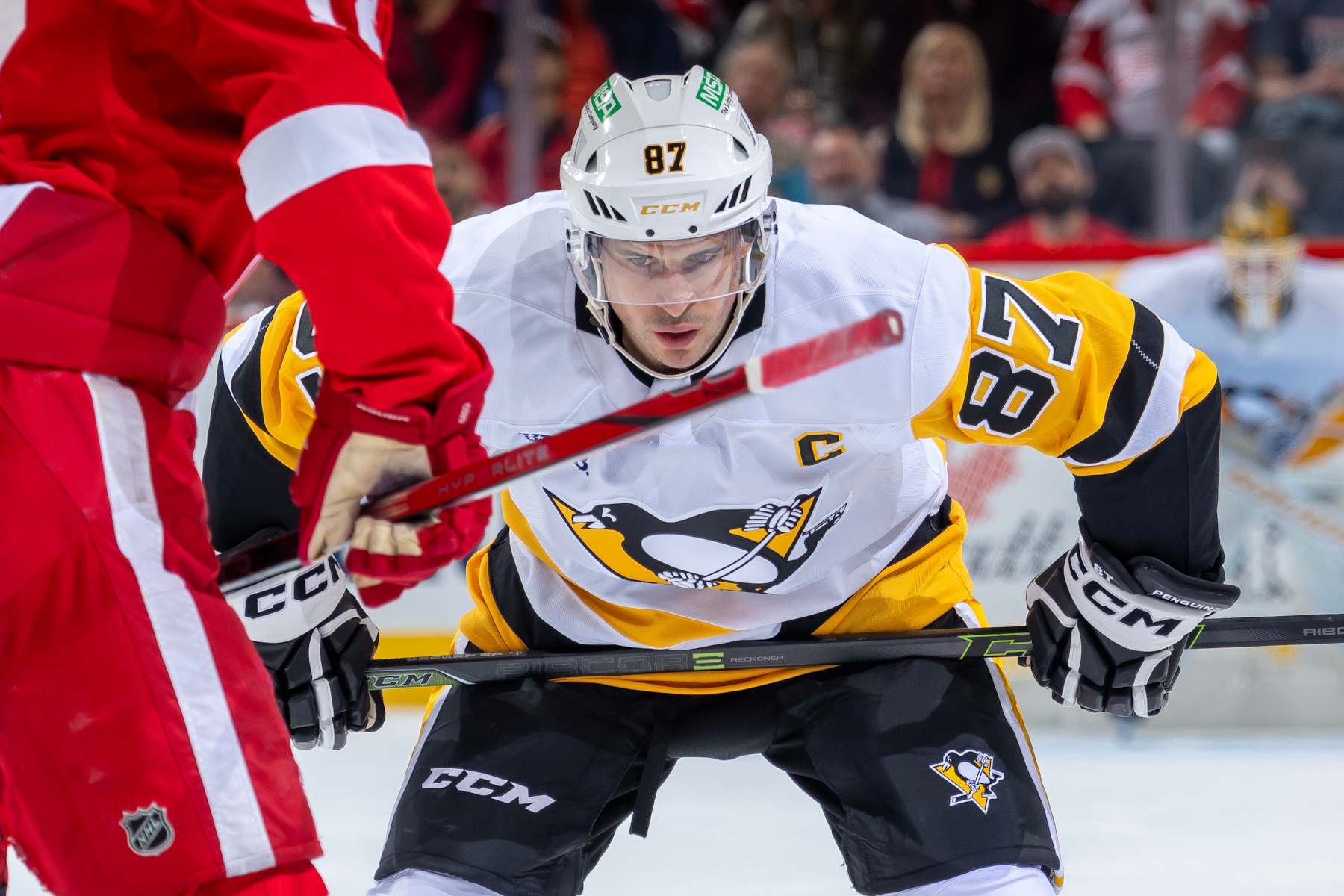 DETROIT, MICHIGAN - OCTOBER 10: Sidney Crosby #87 of the Pittsburgh Penguins gets set for the face-off against the Detroit Red Wings during the second period at Little Caesars Arena on October 10, 2024 in Detroit, Michigan. Pittsburgh defeated Detroit 6-3. (Photo by Dave Reginek/NHLI via Getty Images)