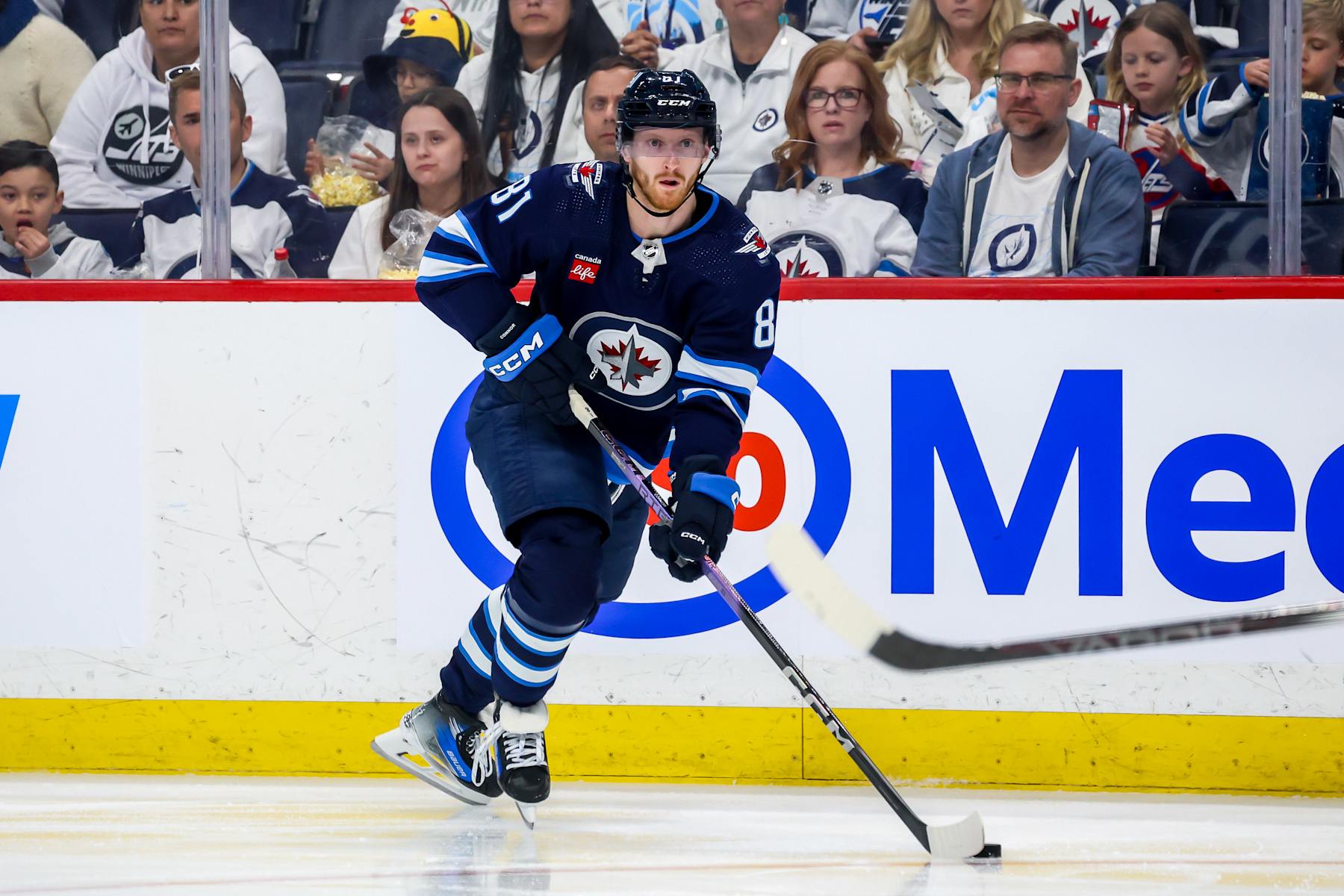 WINNIPEG, CANADA - APRIL 30: Kyle Connor #81 of the Winnipeg Jets plays the puck up the ice during second period action against the Colorado Avalanche in Game Five of the First Round of the 2024 Stanley Cup Playoffs at the Canada Life Centre on April 30, 2024 in Winnipeg, Manitoba, Canada. (Photo by Jonathan Kozub/NHLI via Getty Images)