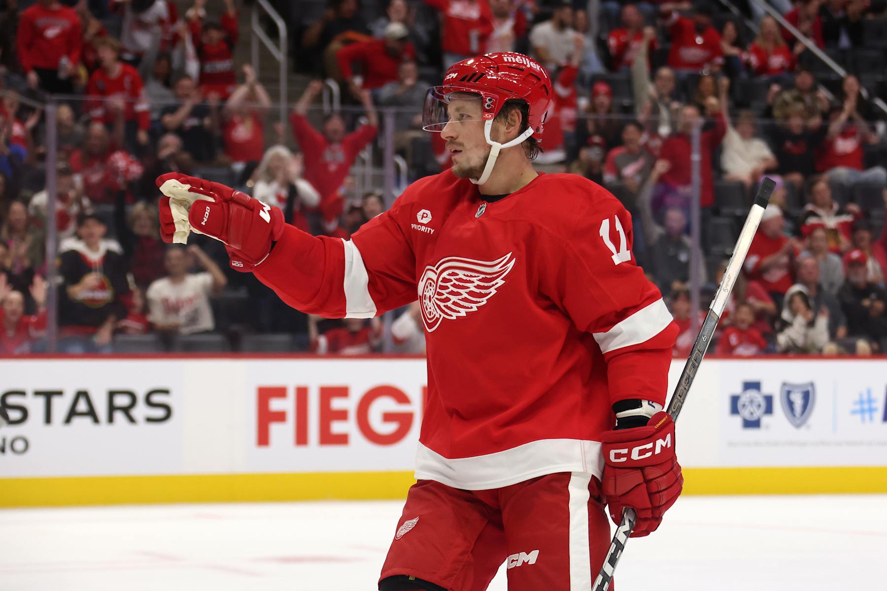 DETROIT, MICHIGAN - SEPTEMBER 27: Vladimir Tarasenko #11 of the Detroit Red Wings celebrates his second period goal while playing the Chicago Blackhawks during a pre season game at Little Caesars Arena on September 27, 2024 in Detroit, Michigan.  (Photo by Gregory Shamus/Getty Images)