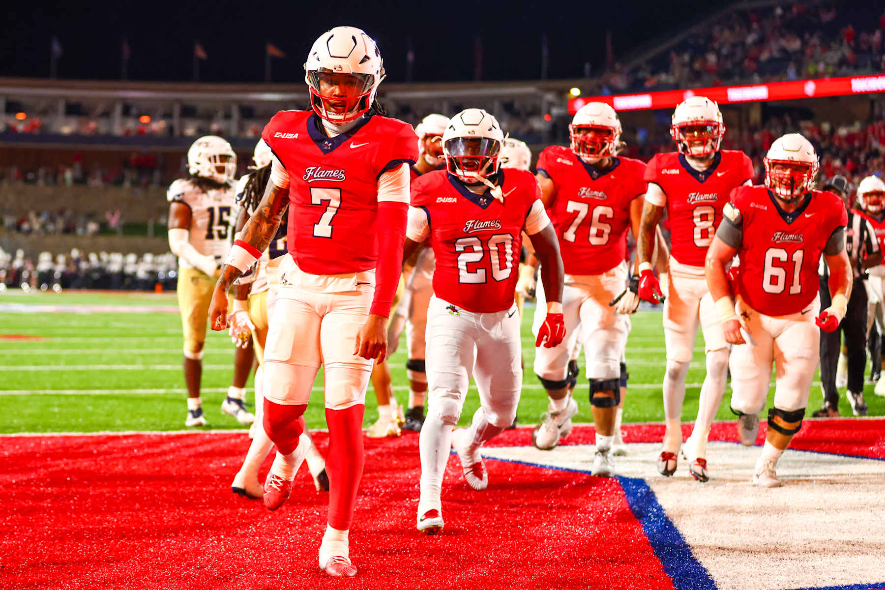 LYNCHBURG, VIRGINIA - OCTOBER 08: Kaidon Salter #7 of the Liberty Flames reacts after scoring a touchdown during the first half of a football game against the Florida International University Panthers at Williams Stadium on October 08, 2024 in Lynchburg, Virginia.  (Photo by David Jensen/Getty Images)