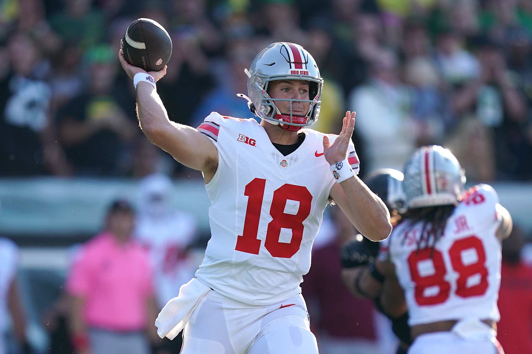 EUGENE, OREGON - OCTOBER 12: Will Howard #18 of the Ohio State Buckeyes throws the ball during the first quarter against the Oregon Ducks at Autzen Stadium on October 12, 2024 in Eugene, Oregon. (Photo by Ali Gradischer/Getty Images)