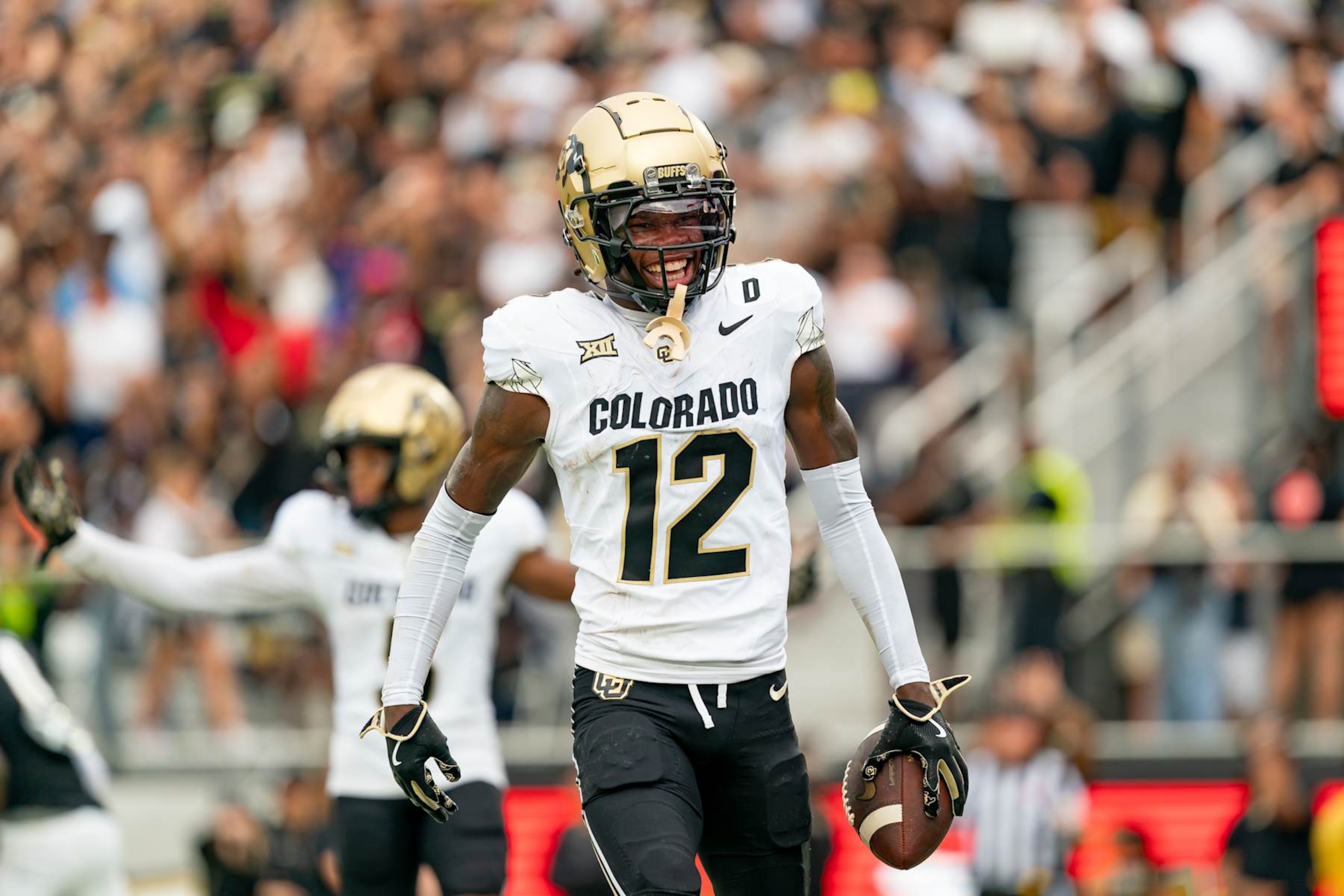 ORLANDO, FL - SEPTEMBER 28:Colorado Buffaloes wide receiver Travis Hunter (12) smiles after a touchdown during a college football game between the Colorado Buffaloes and the UCF Knights on September 28th, 2024 at FBC Mortgage Stadium in Orlando, FL. (Photo by Chris Leduc/Icon Sportswire via Getty Images) ORLANDO, FL - SEPTEMBER 28:Colorado Buffaloes wide receiver Travis Hunter (12) smiles after a touchdown during a college football game between the Colorado Buffaloes and the UCF Knights on September 28th, 2024 at FBC Mortgage Stadium in Orlando, FL. (Photo by Chris Leduc/Icon Sportswire via Getty Images)