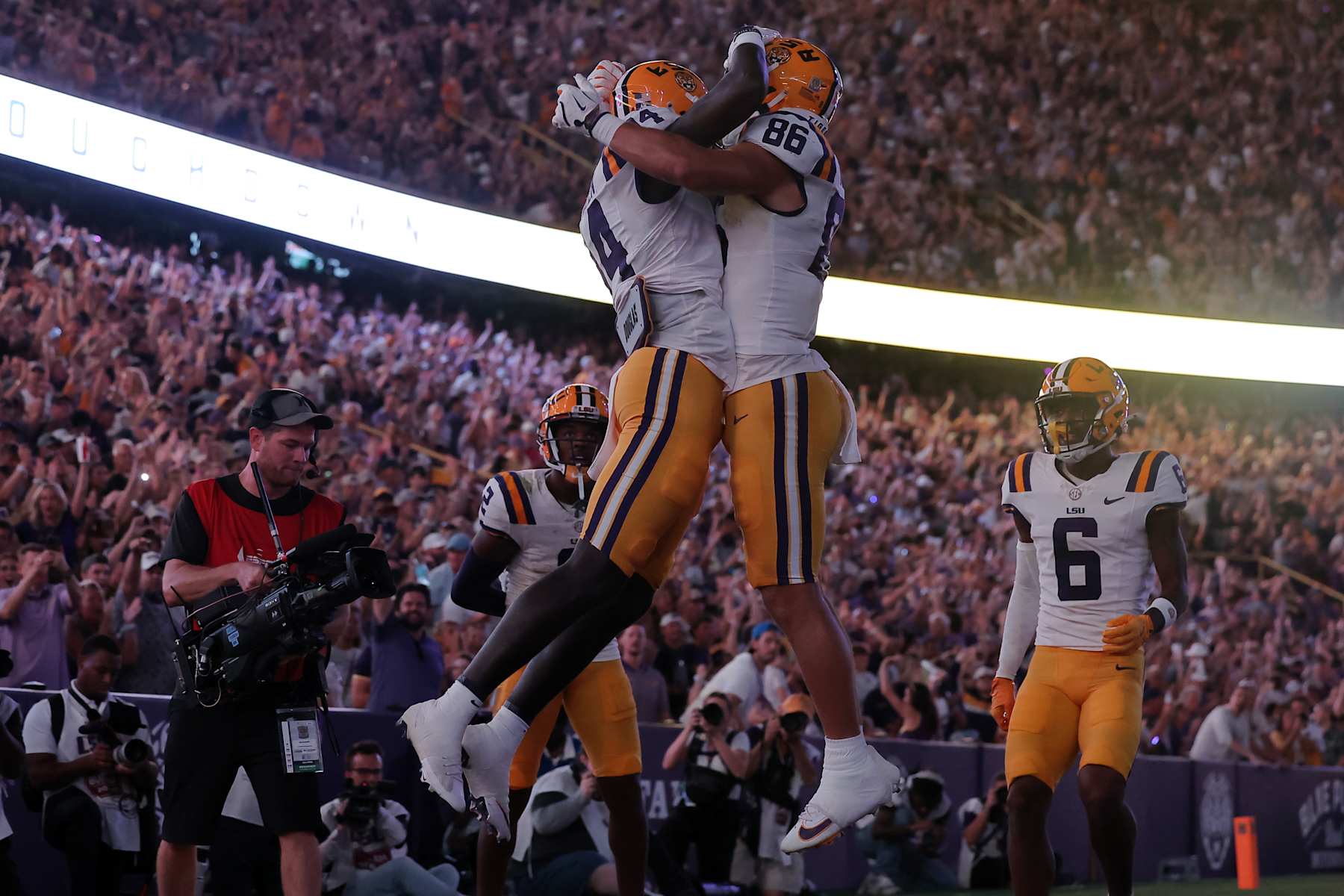 BATON ROUGE, LOUISIANA - OCTOBER 12: Trey'Dez Green #14 of the LSU Tigers celebrates a touchdown with Mason Taylor #86 during the first half of a game against the Mississippi Rebels at Tiger Stadium on October 12, 2024 in Baton Rouge, Louisiana. (Photo by Jonathan Bachman/Getty Images)