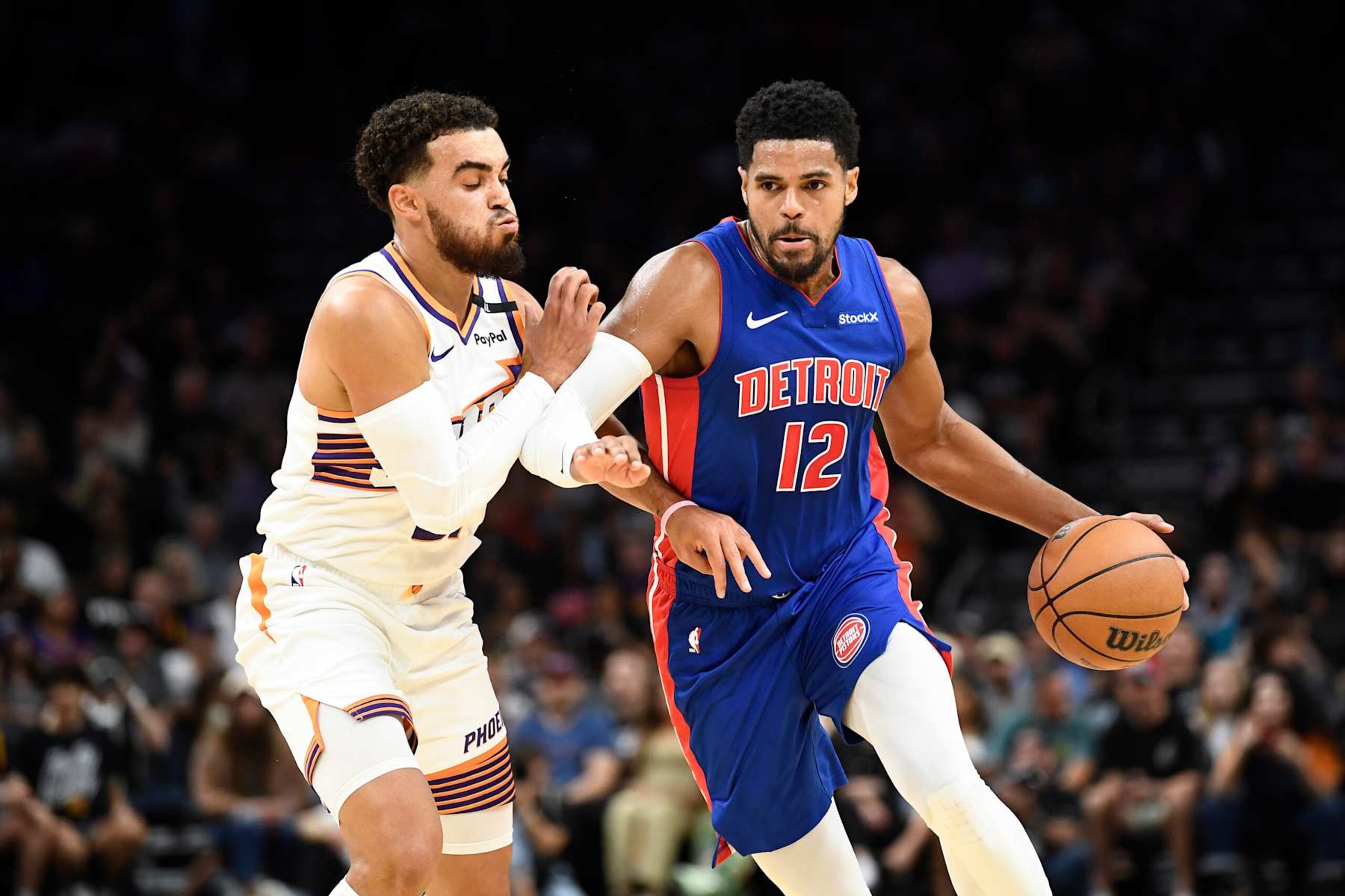 PHOENIX, ARIZONA - OCTOBER 11: Tobias Harris #12 of the Detroit Pistons controls the ball against Tyus Jones #21 of the Phoenix Suns during the first half of the preseason game at Footprint Center on October 11, 2024 in Phoenix, Arizona.  NOTE TO USER: User expressly acknowledges and agrees that, by downloading and/or using this photograph, user is consenting to the terms and conditions of the Getty Images License Agreement. (Photo by Kelsey Grant/Getty Images)