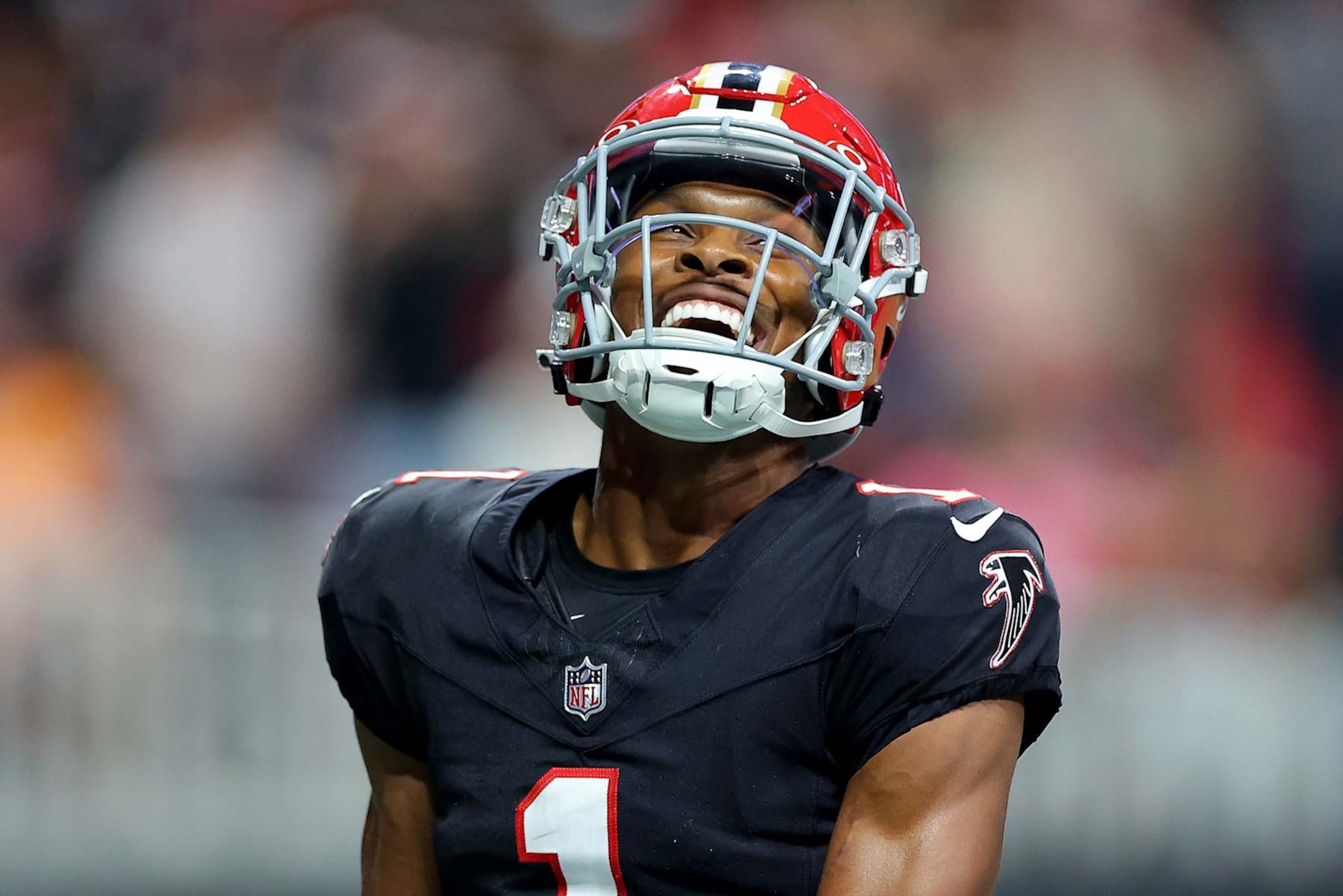 ATLANTA, GEORGIA - OCTOBER 03: Darnell Mooney #1 of the Atlanta Falcons celebrates after scoring a touchdown against the Tampa Bay Buccaneers during the second quarter at Mercedes-Benz Stadium on October 03, 2024 in Atlanta, Georgia. (Photo by Kevin C. Cox/Getty Images)